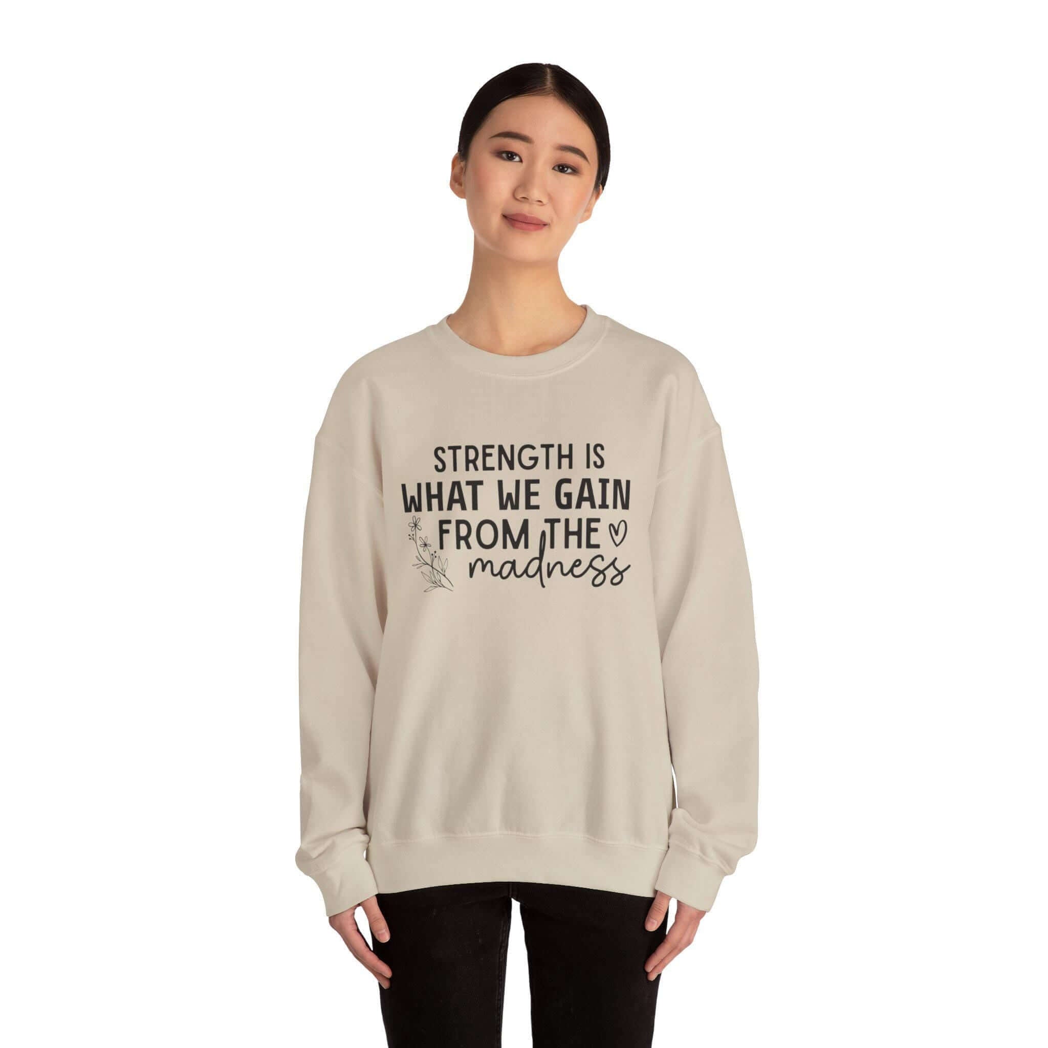 Cozy Fleece Unisex Sweatshirt - Strength Is What We Gain From Madness