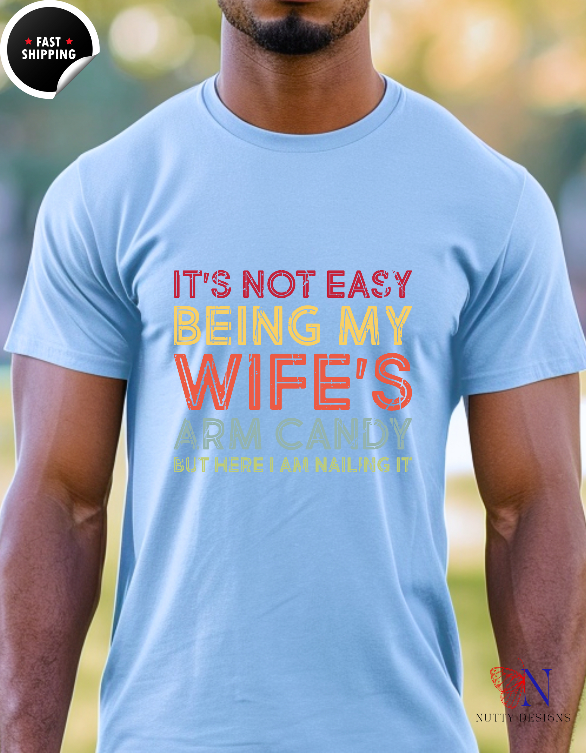It's Not Easy Being My Wife's Arm Candy But Here I Am Nailing T-Shirt Lifestyle Mockup | Nutty Designs