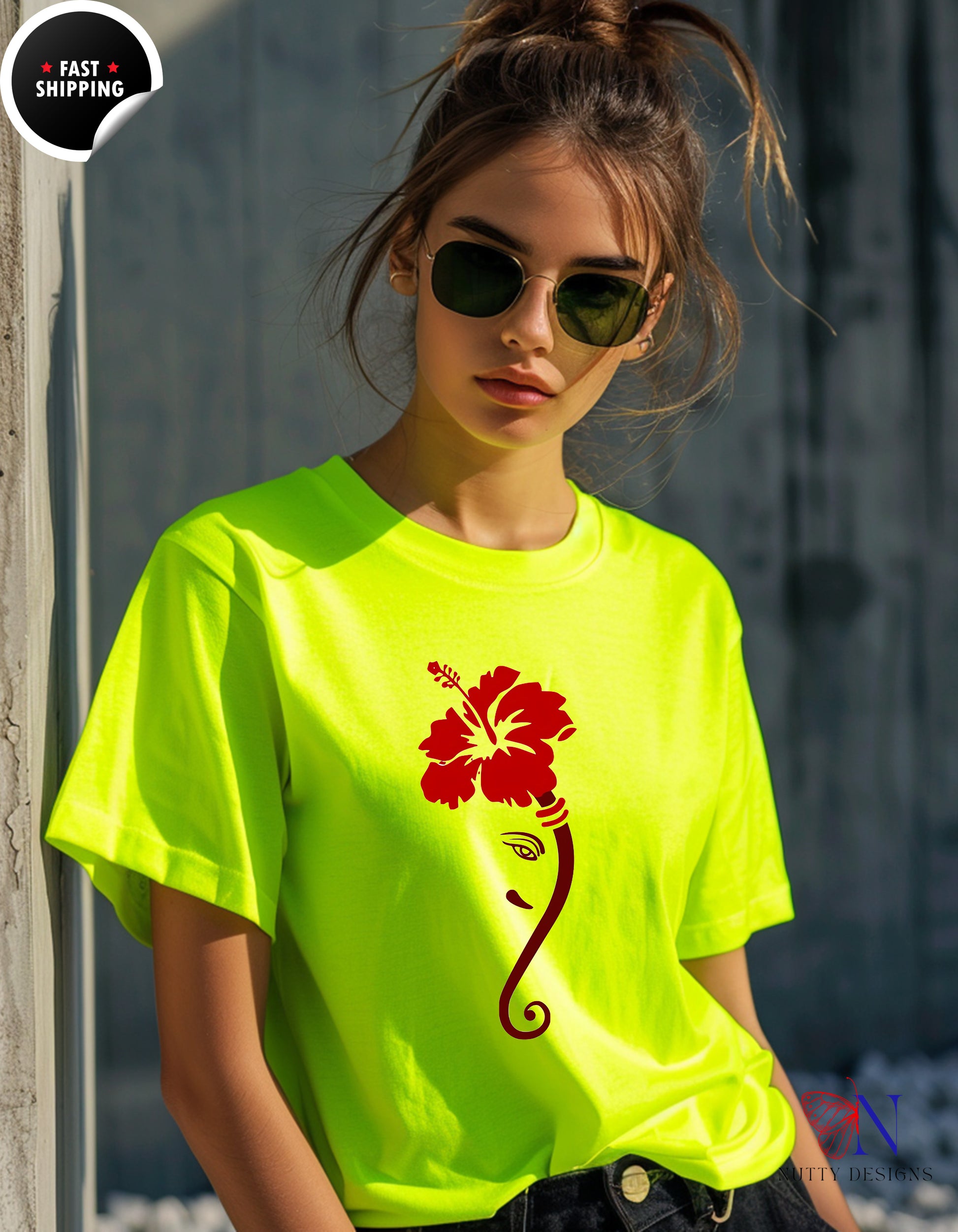 a woman wearing a neon yellow shirt with a flower on it