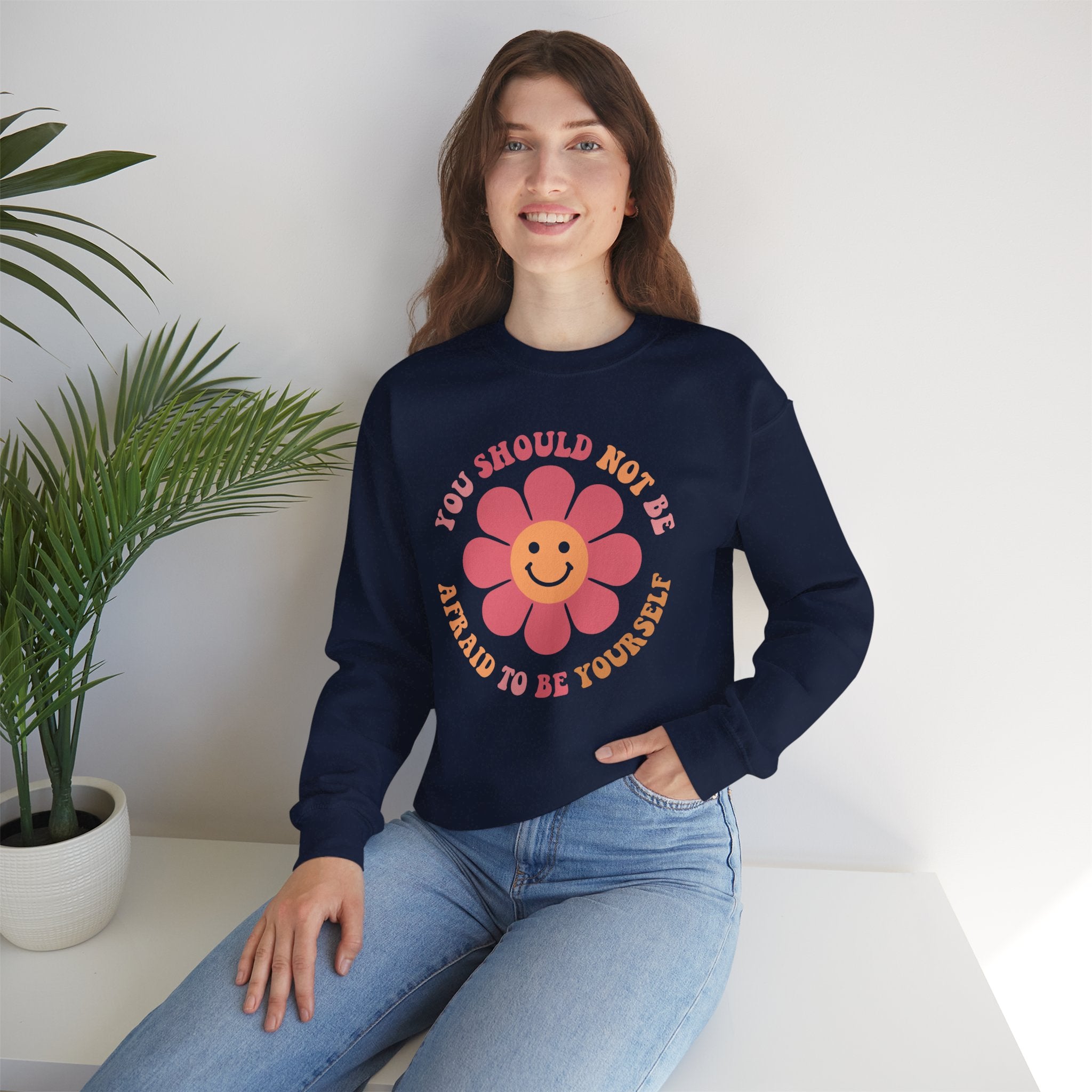 Woman wearing positive affirmation crewneck sweatshirt with flower design, cozy fall autumn unisex inspirational sweater for mental health.