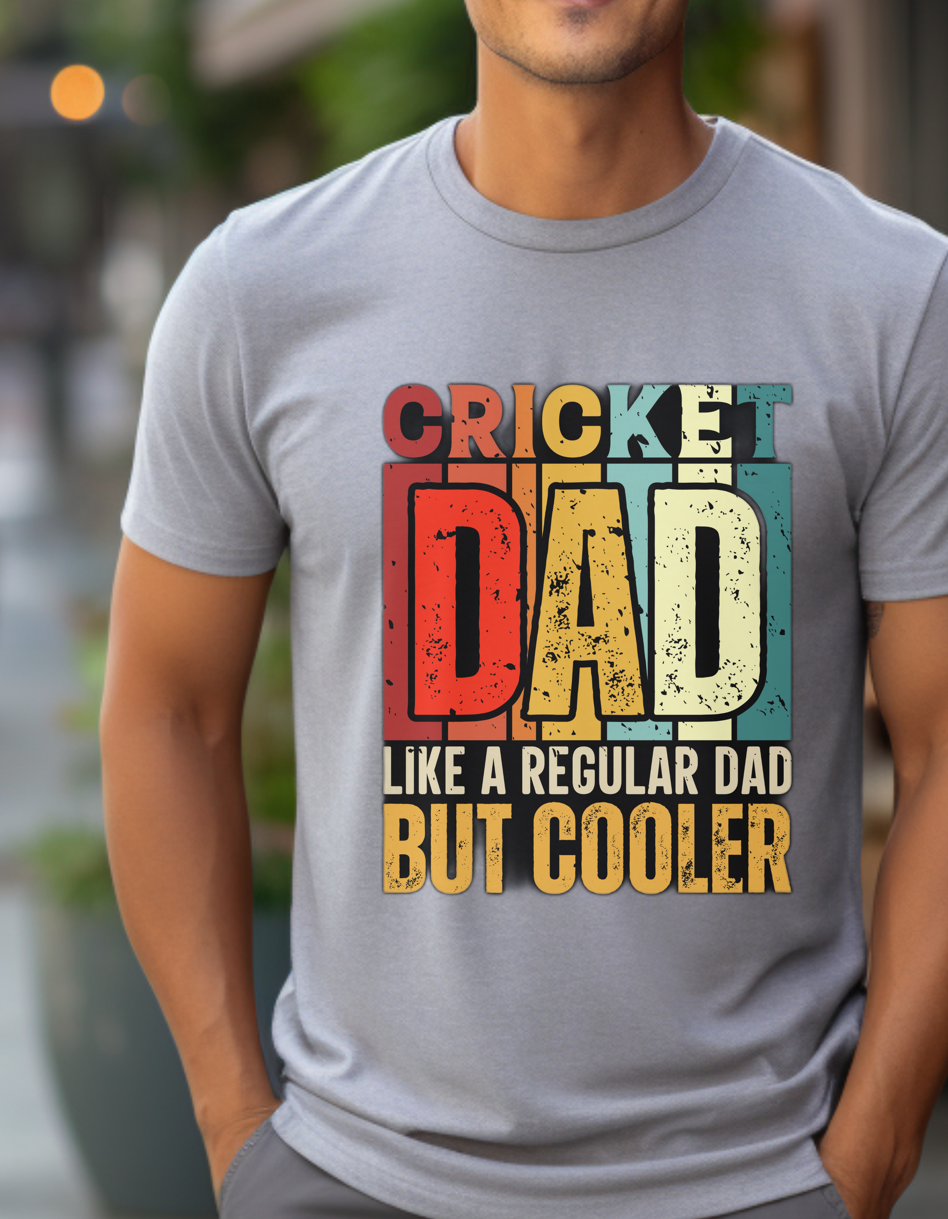 a man wearing a t - shirt that says cricket dad like a regular dad but