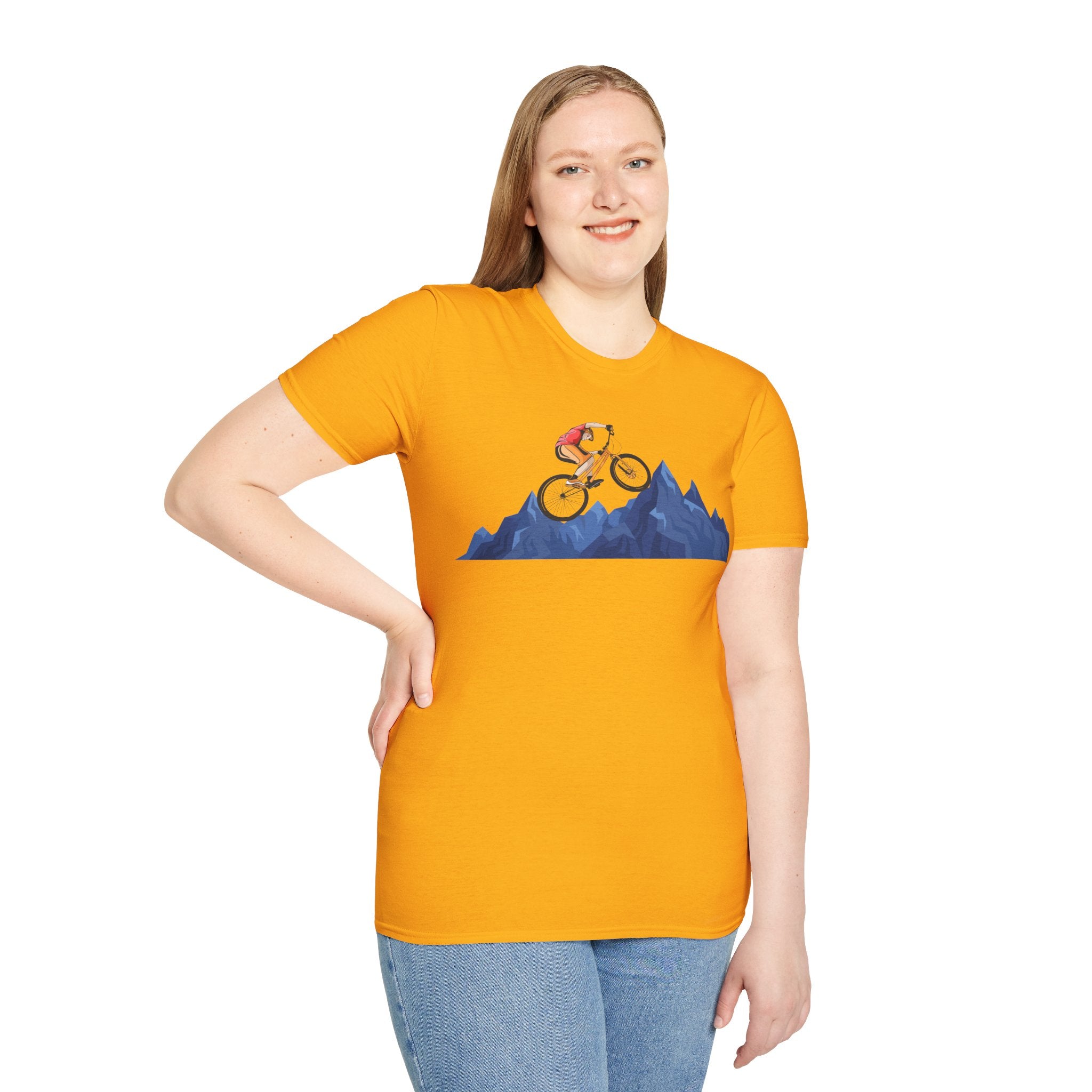 Woman wearing orange mountain biking retro t-shirt with cyclist graphic, unisex biker tee for vintage biking enthusiasts.