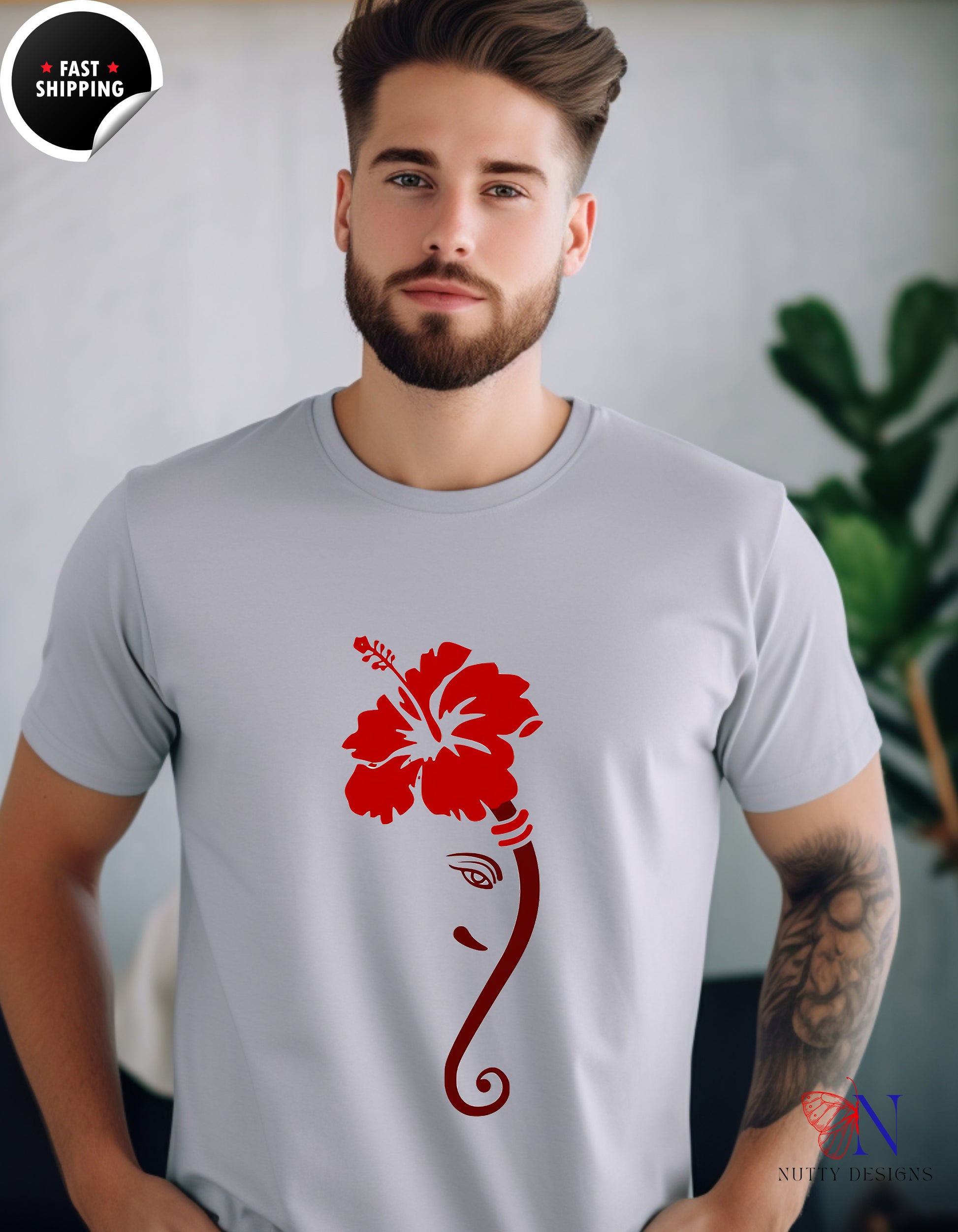 a man with a beard wearing a t - shirt with a flower on it