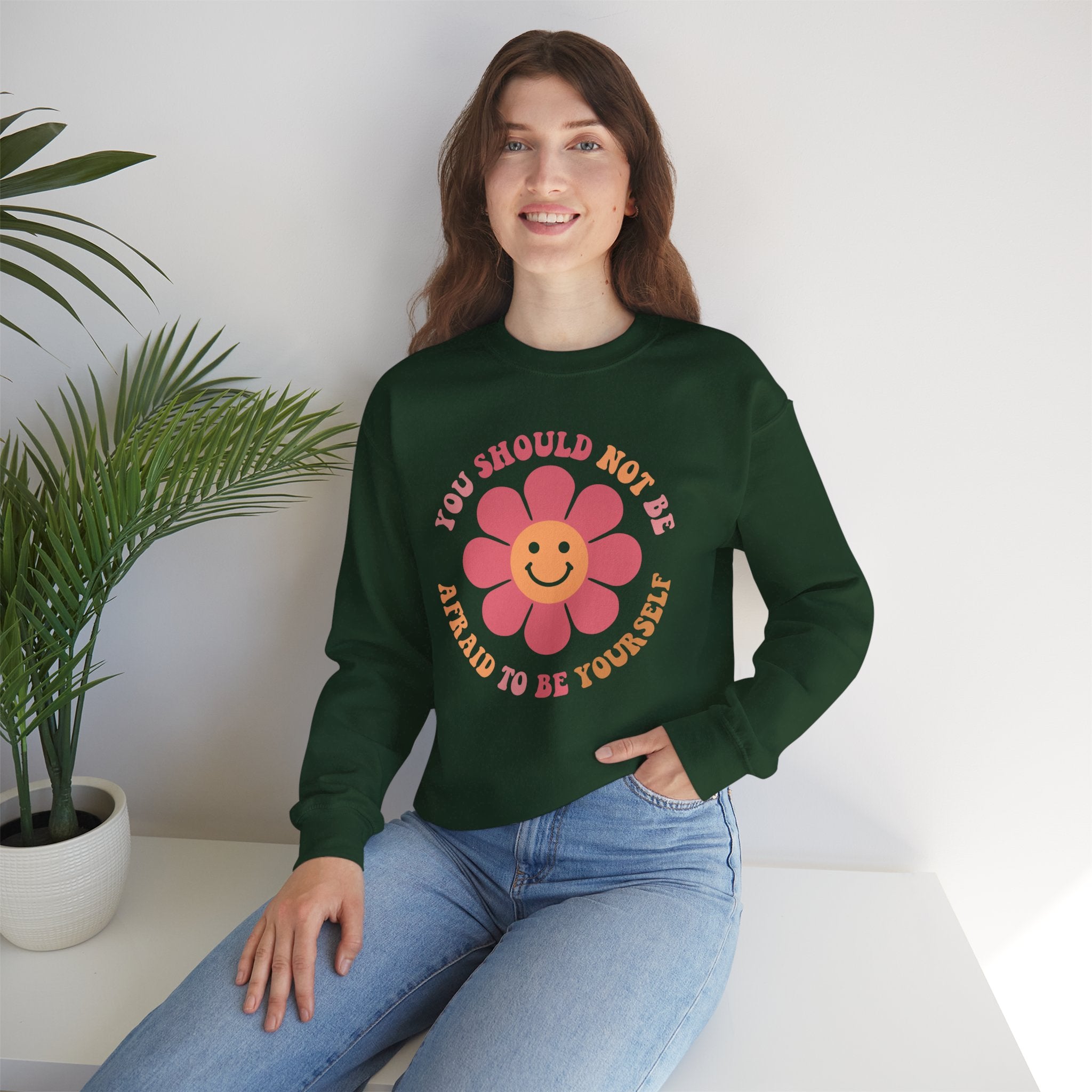 Model wearing positive affirmation crewneck sweatshirt with "You Should Not Be Afraid To Be Yourself" text, cozy fall unisex sweater
