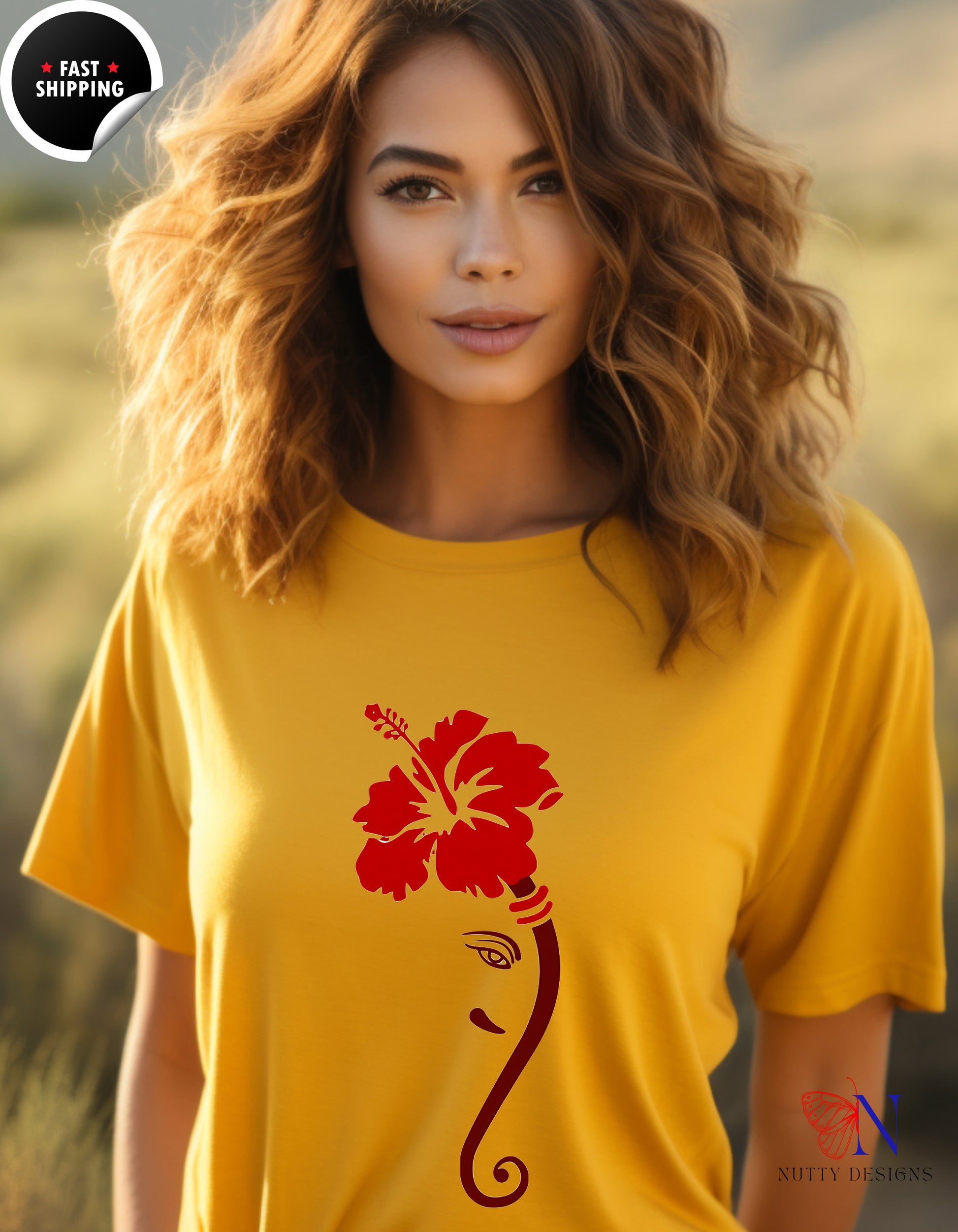 a woman wearing a yellow shirt with a red flower on it