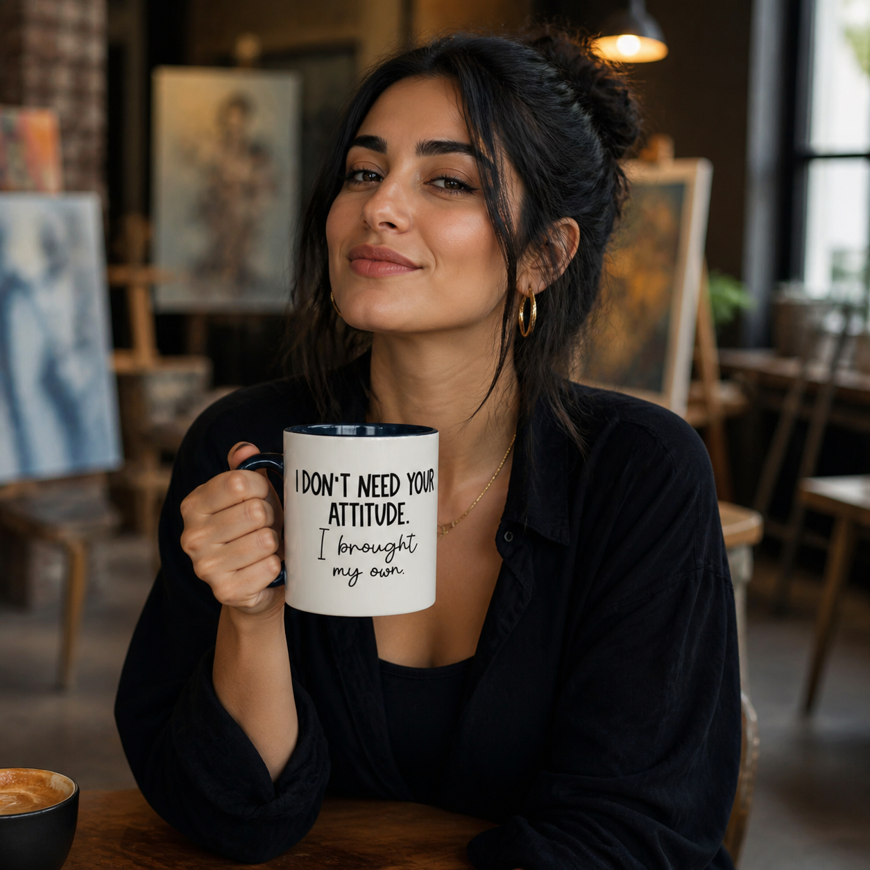 Young woman holding dark-blue-accent I Don't Need Your Attitude mug