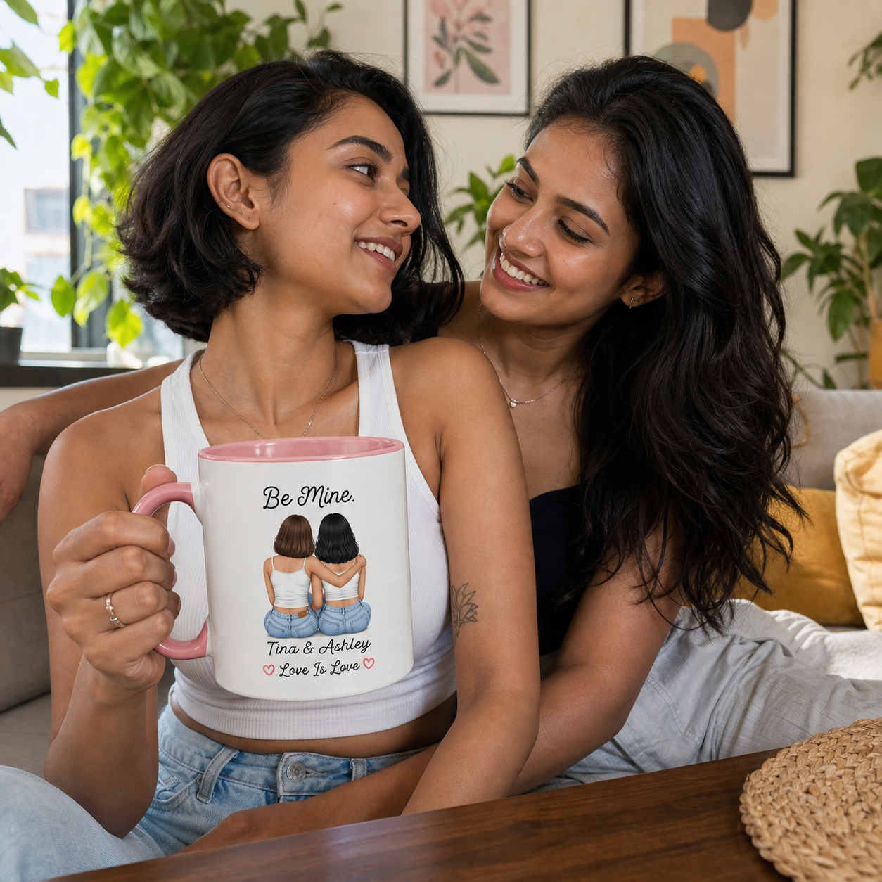 Young couple holding personalized pink-accent Be Mine mug at home