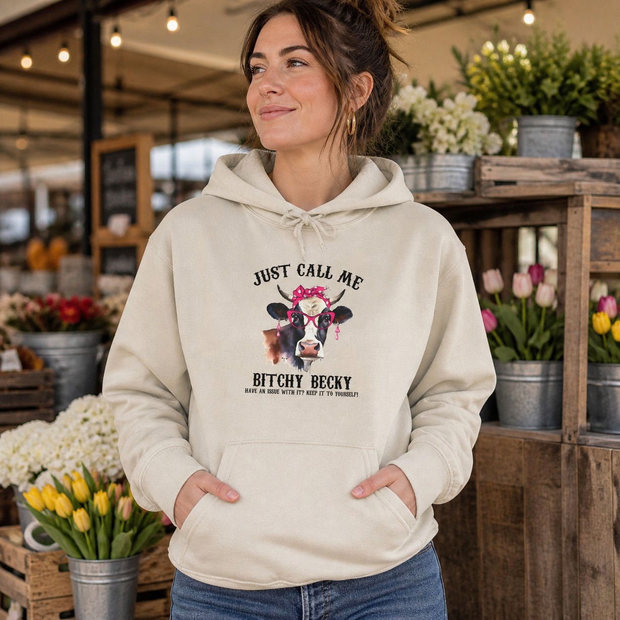 Woman wearing Just Call Me Bitchy Becky cow graphic hoodie outdoors