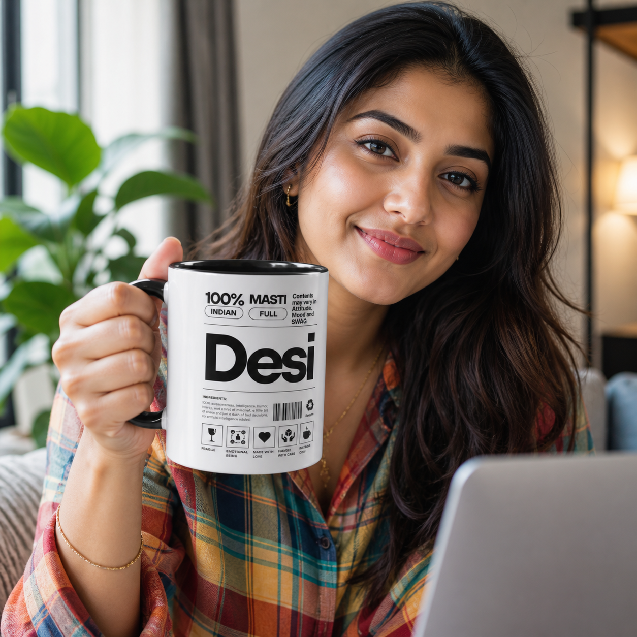 Young Indian woman holding black-accent Desi Roots mug during video call
