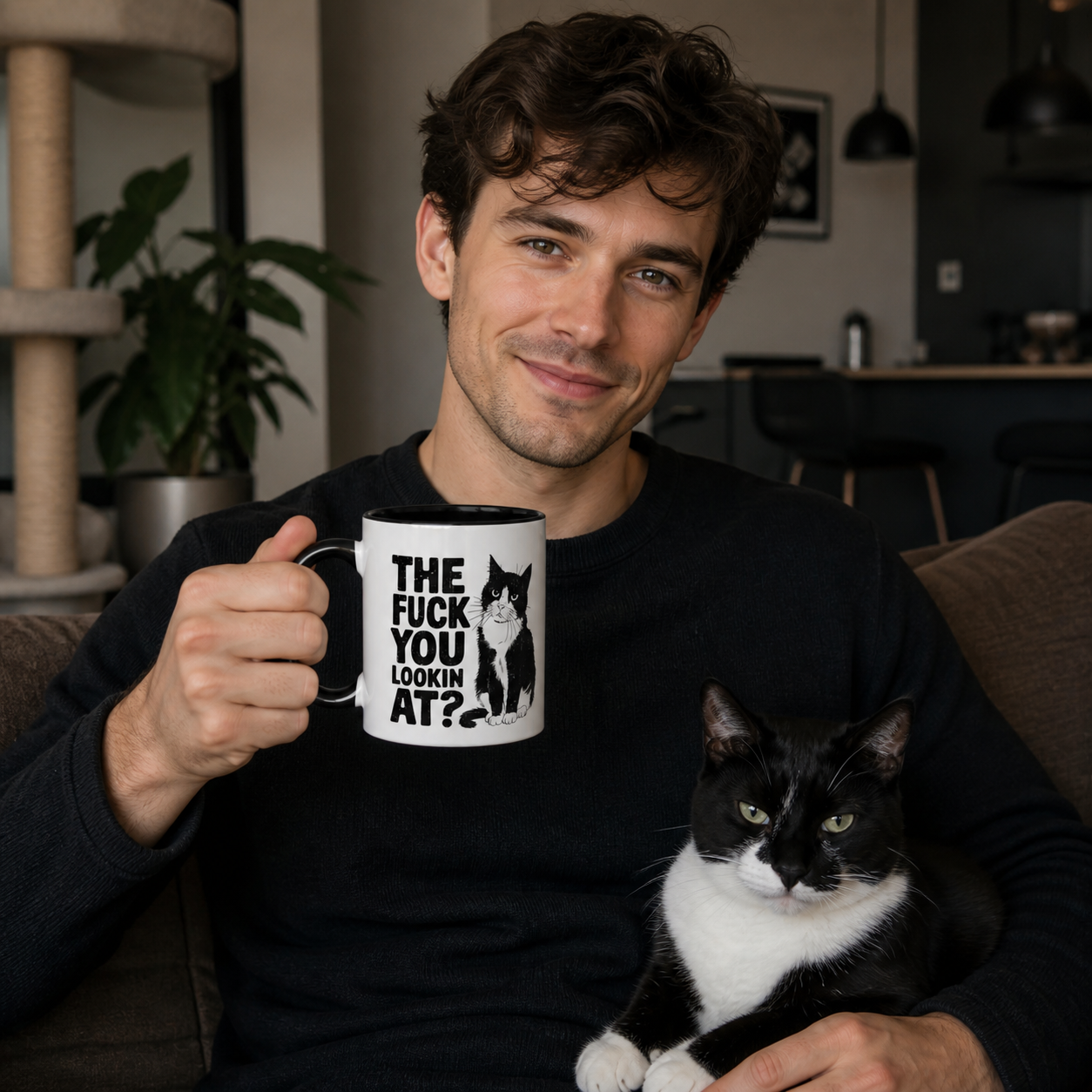 Cat owner holding black-accent The F You Lookin At tuxedo cat mug