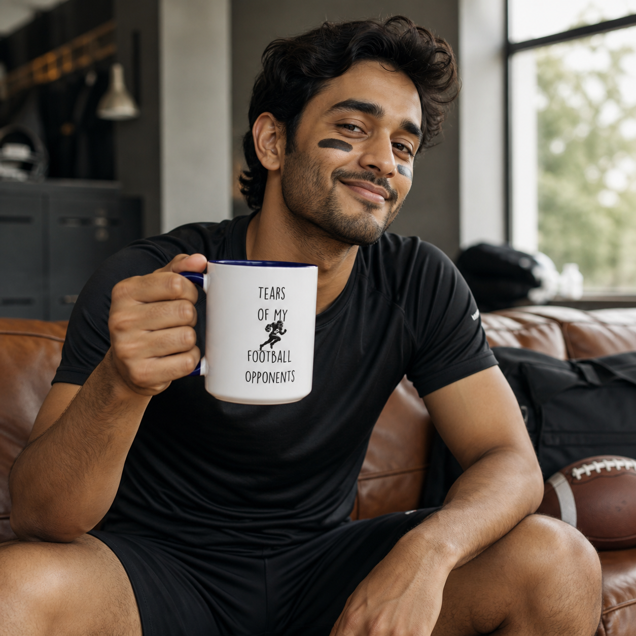 Young football player holding dark-blue-accent Tears of My Football Opponents mug
