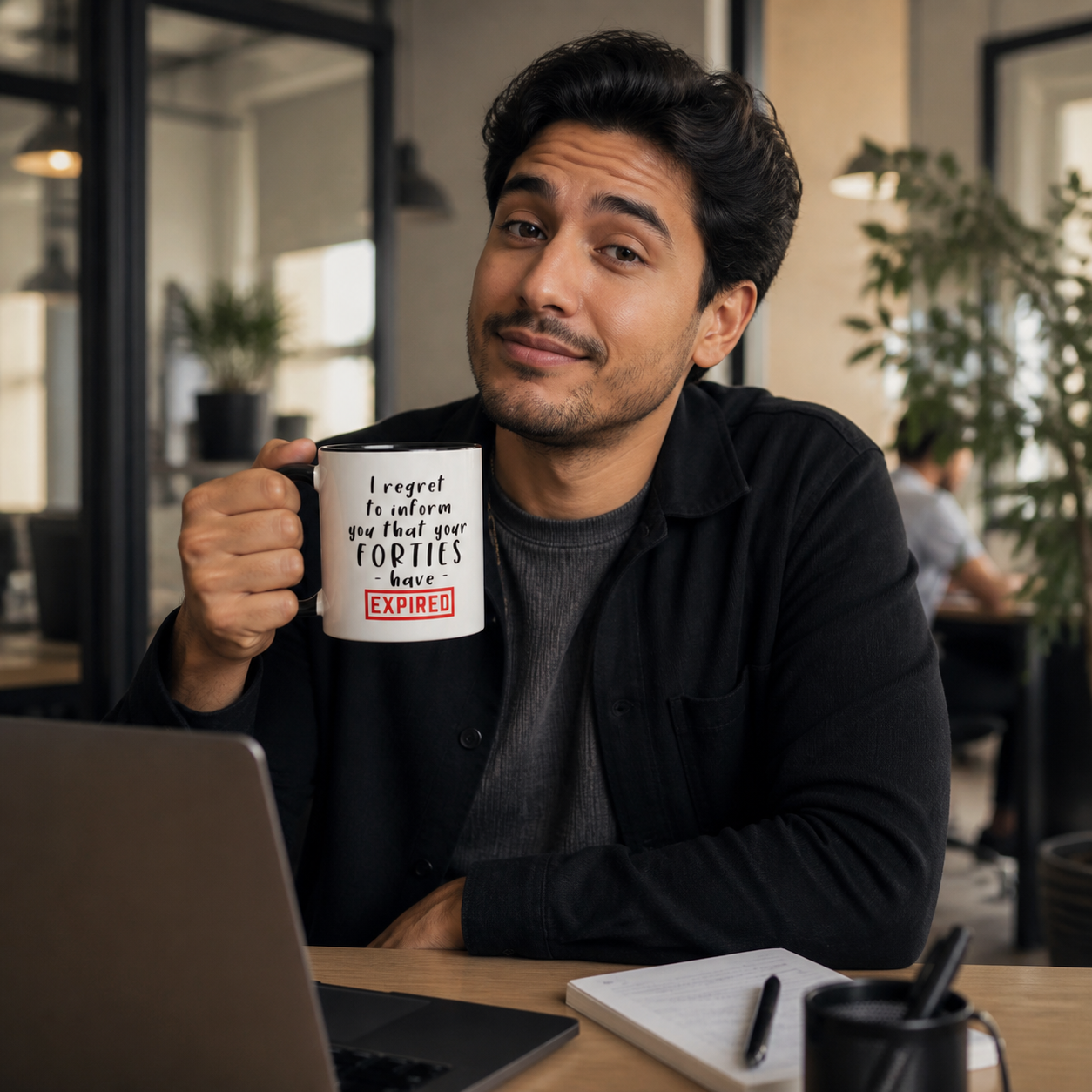 Young man holding black-accent Your Forties Have Expired mug