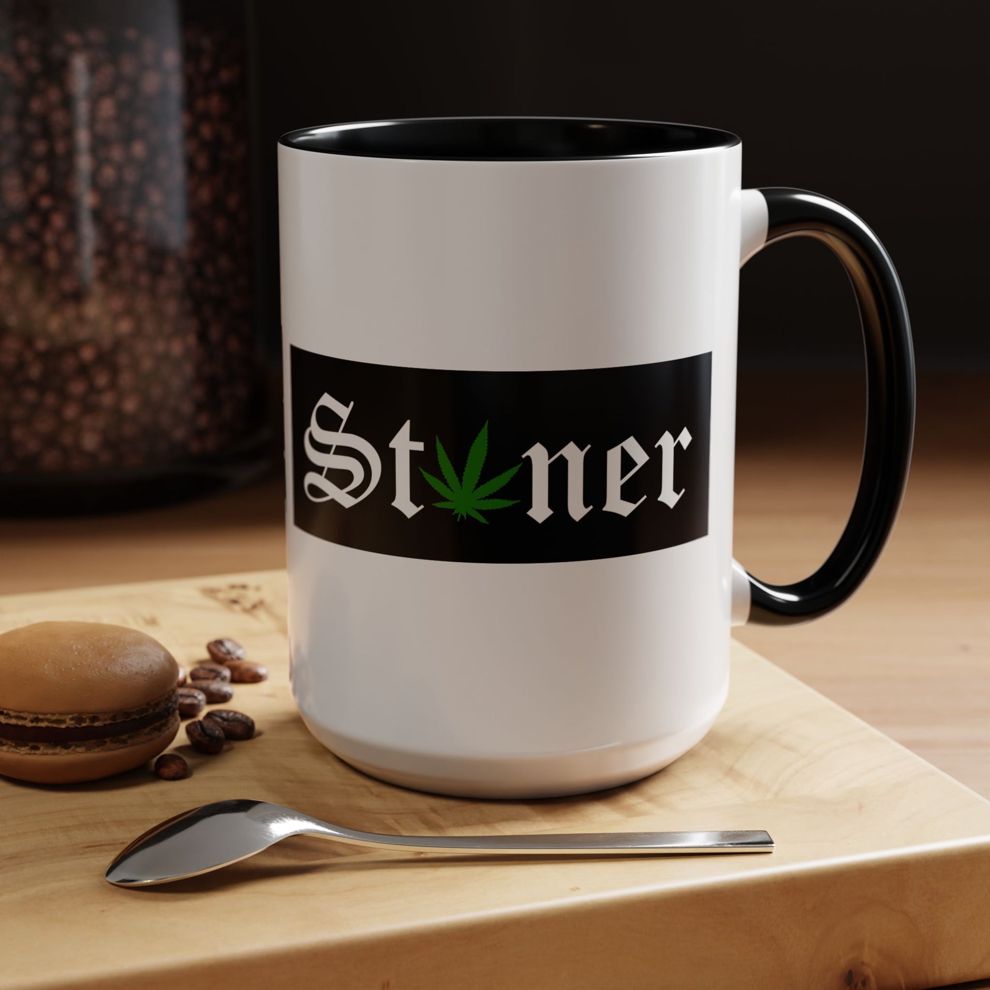 Black and white funny stoner mug on a wooden table with a macaron and spoon, unique gift idea for coffee or tea lovers.