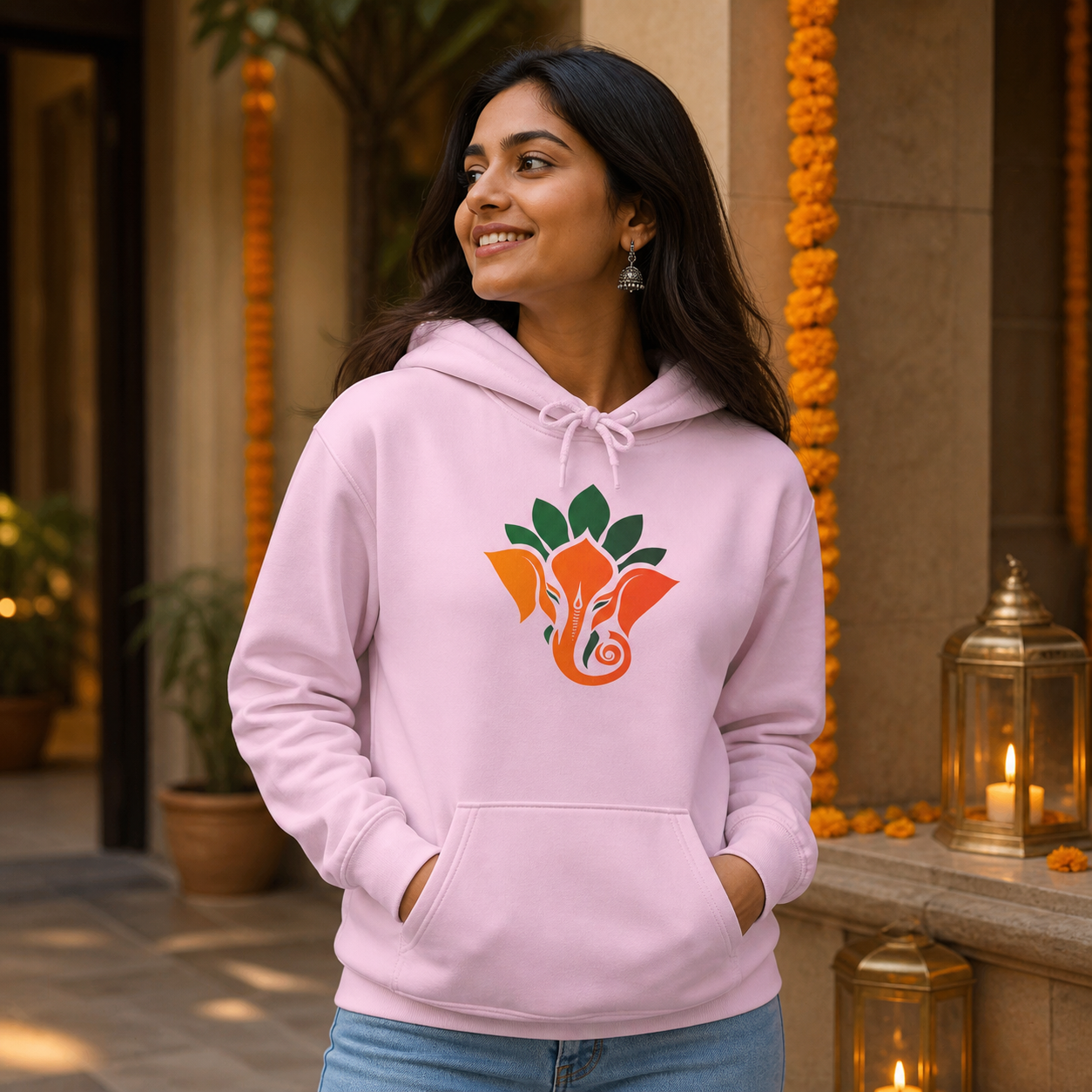 Woman wearing Ganesha lotus graphic hoodie in a warm lifestyle setting