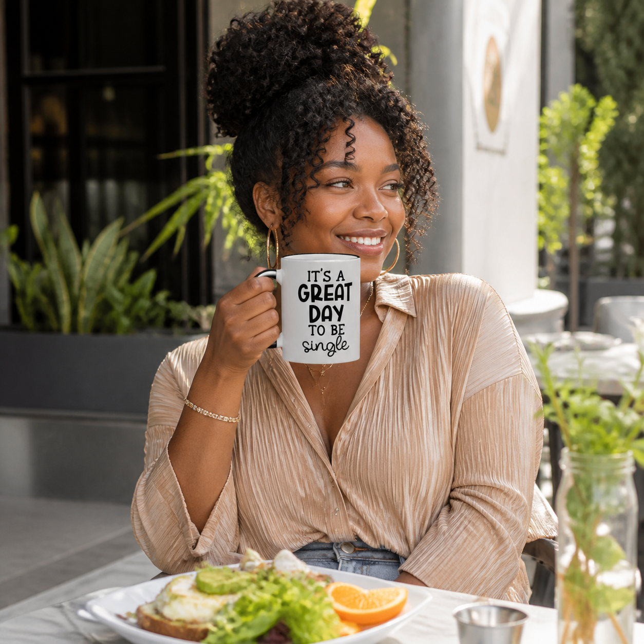 Woman holding black accent It Is a Great Day to Be Single coffee mug at brunch