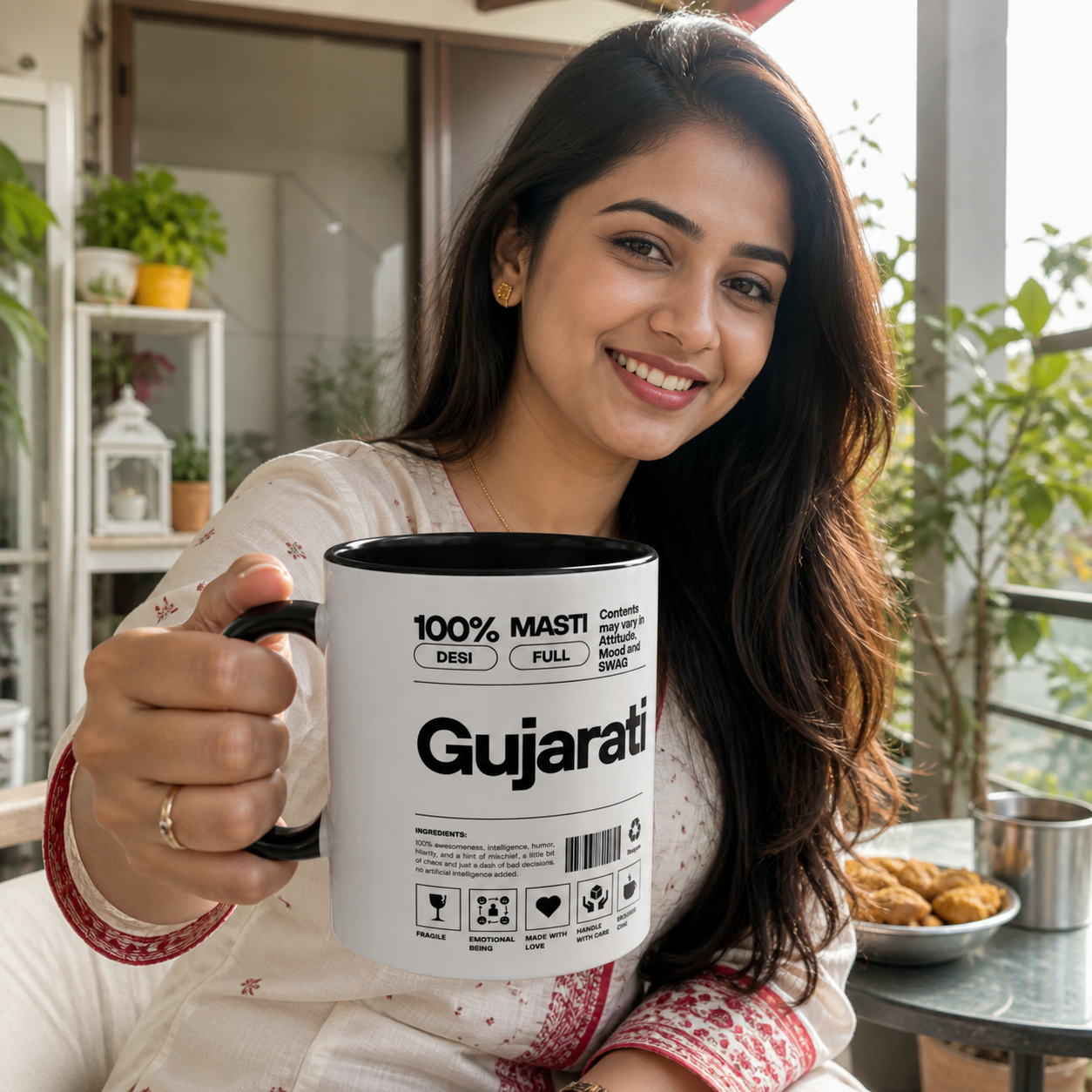 Young Gujarati woman holding black-accent Gujarati Desi Roots mug