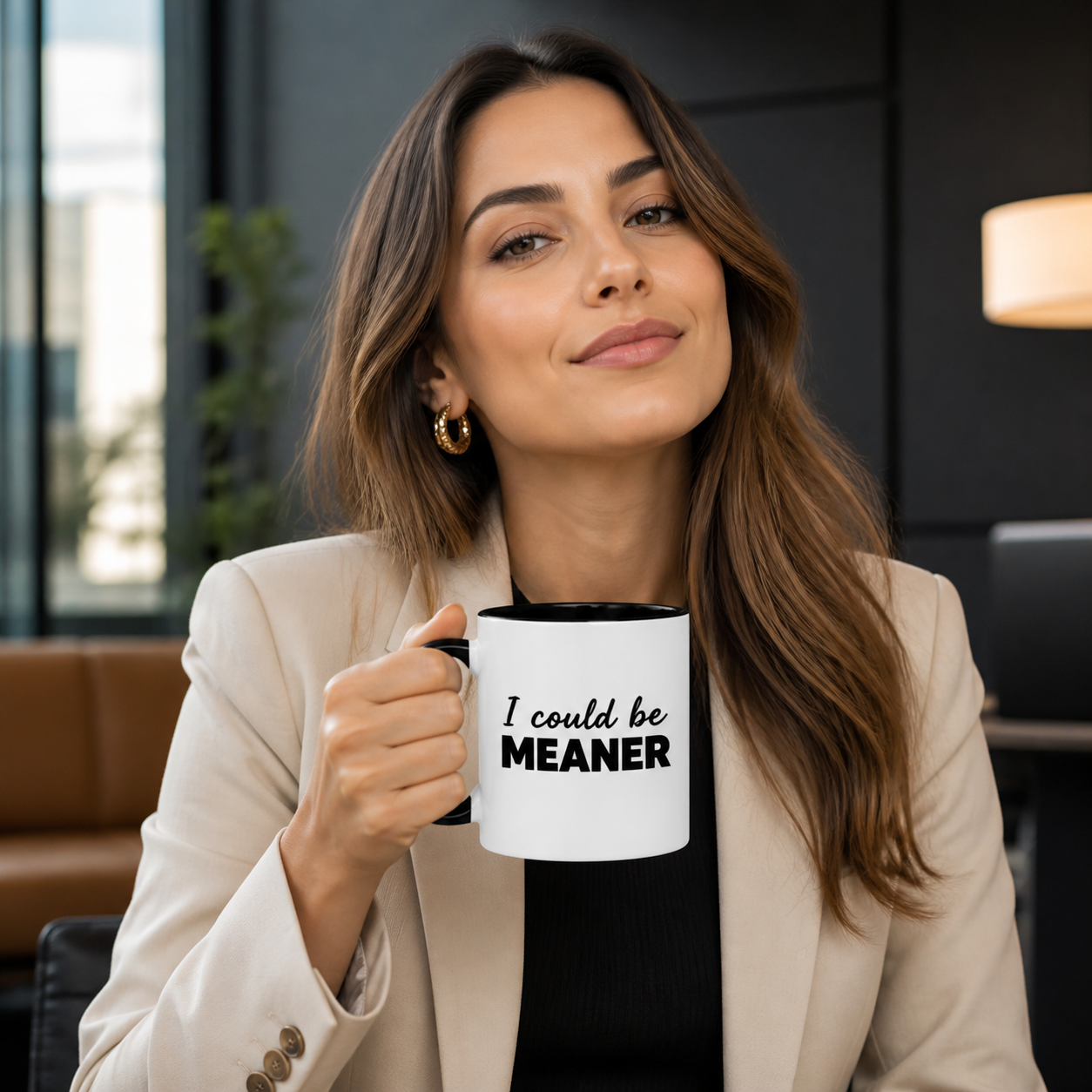 Confident young woman holding black-accent I Could Be Meaner mug