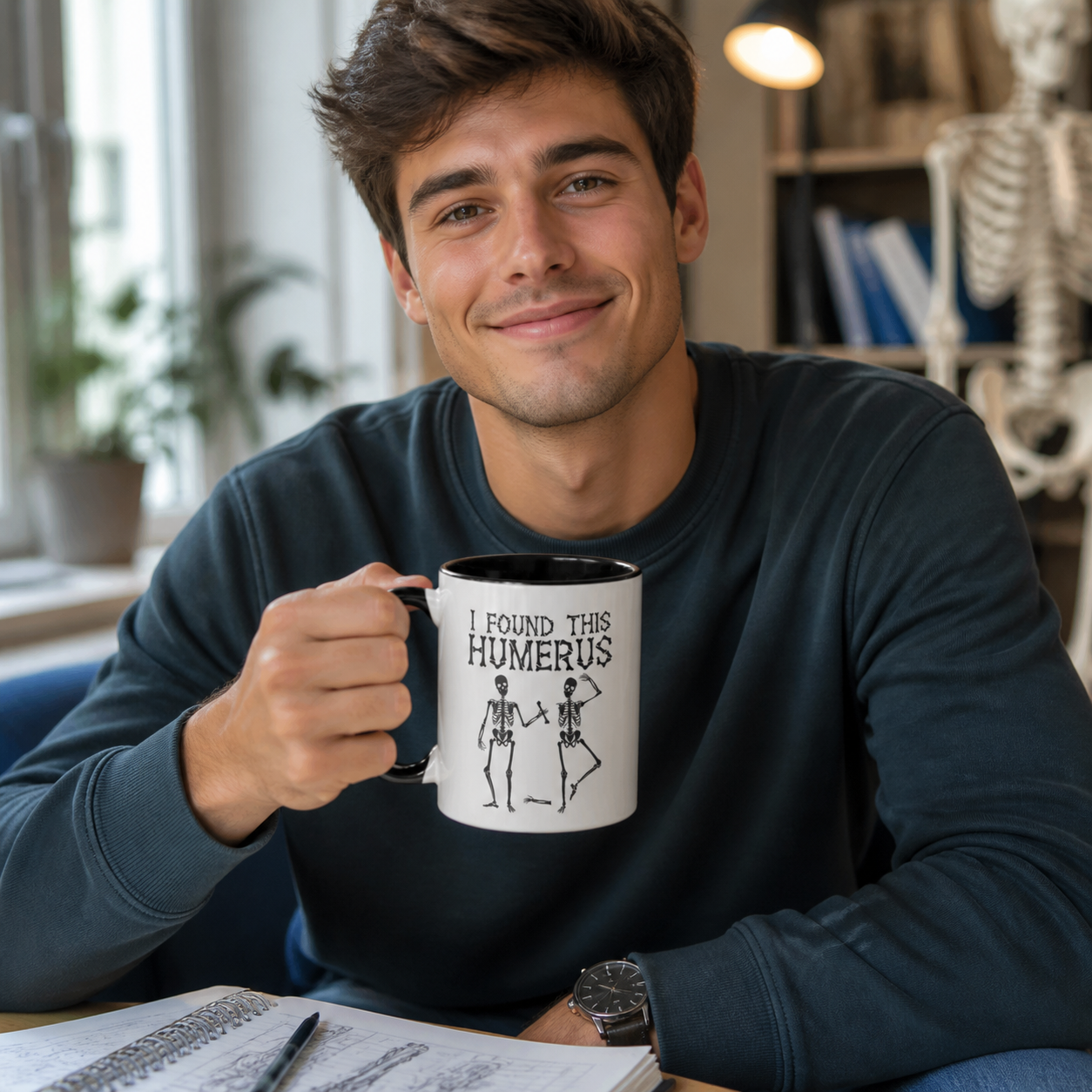 Young medical student holding black-accent I Found This Humerus mug