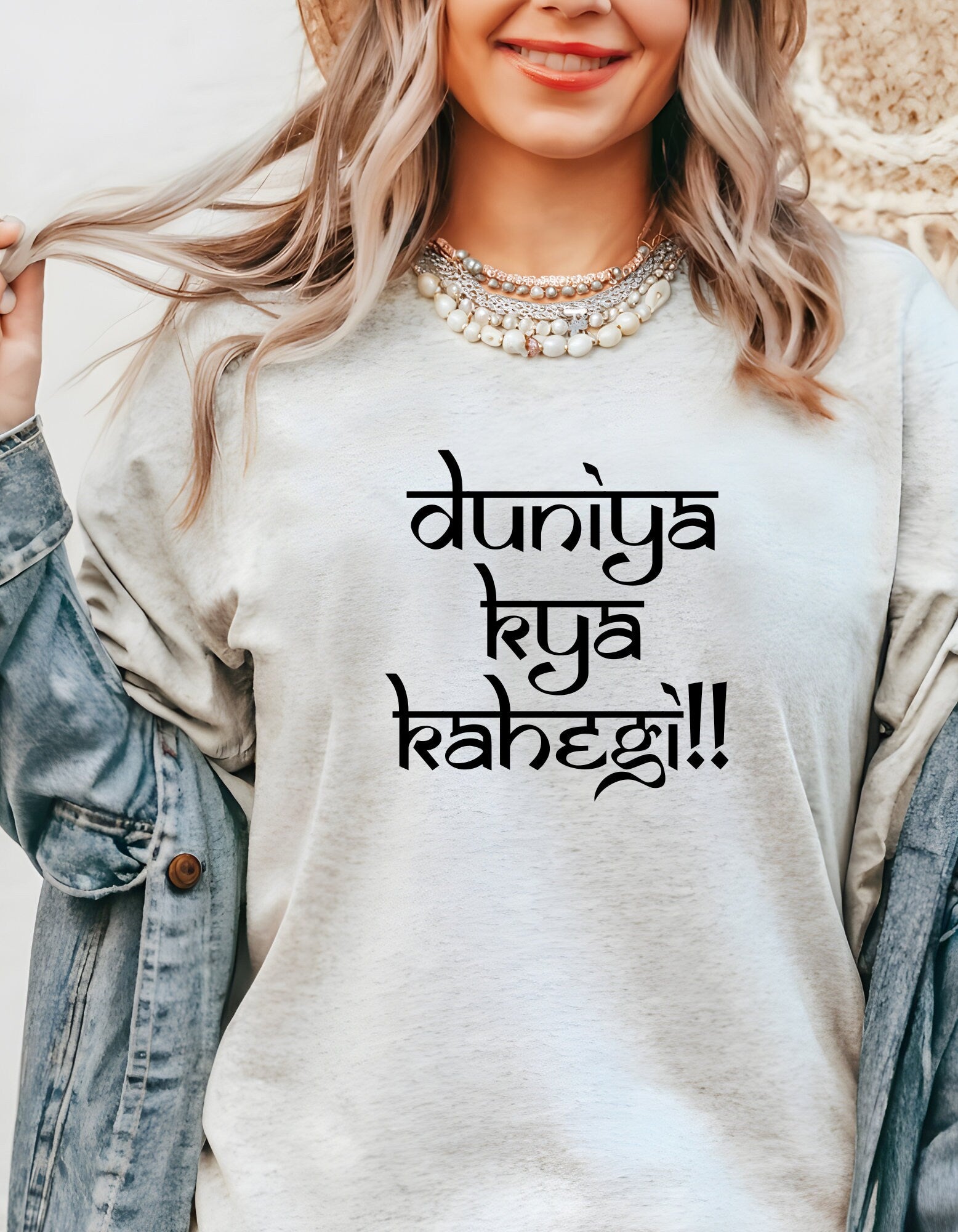 a woman wearing a t - shirt with the words, buddha, in a foreign