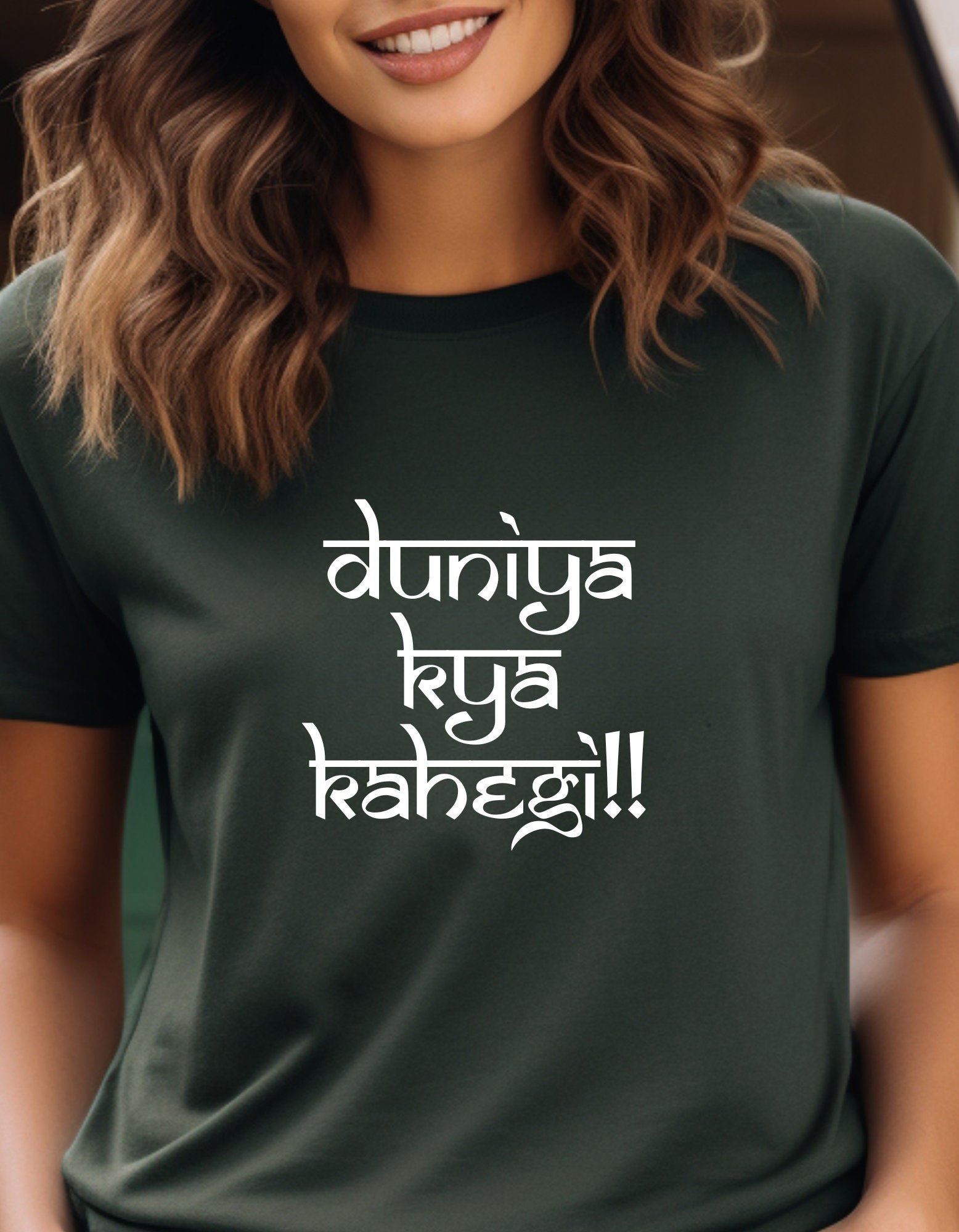 a woman wearing a t - shirt that says duniya ky kahegi