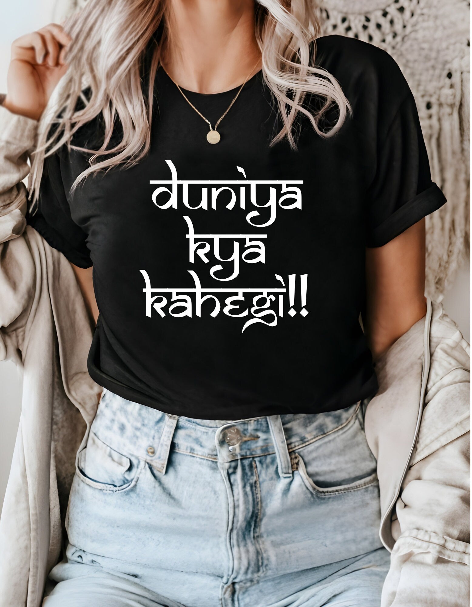 a woman wearing a black t - shirt with the words, don&#39;t be