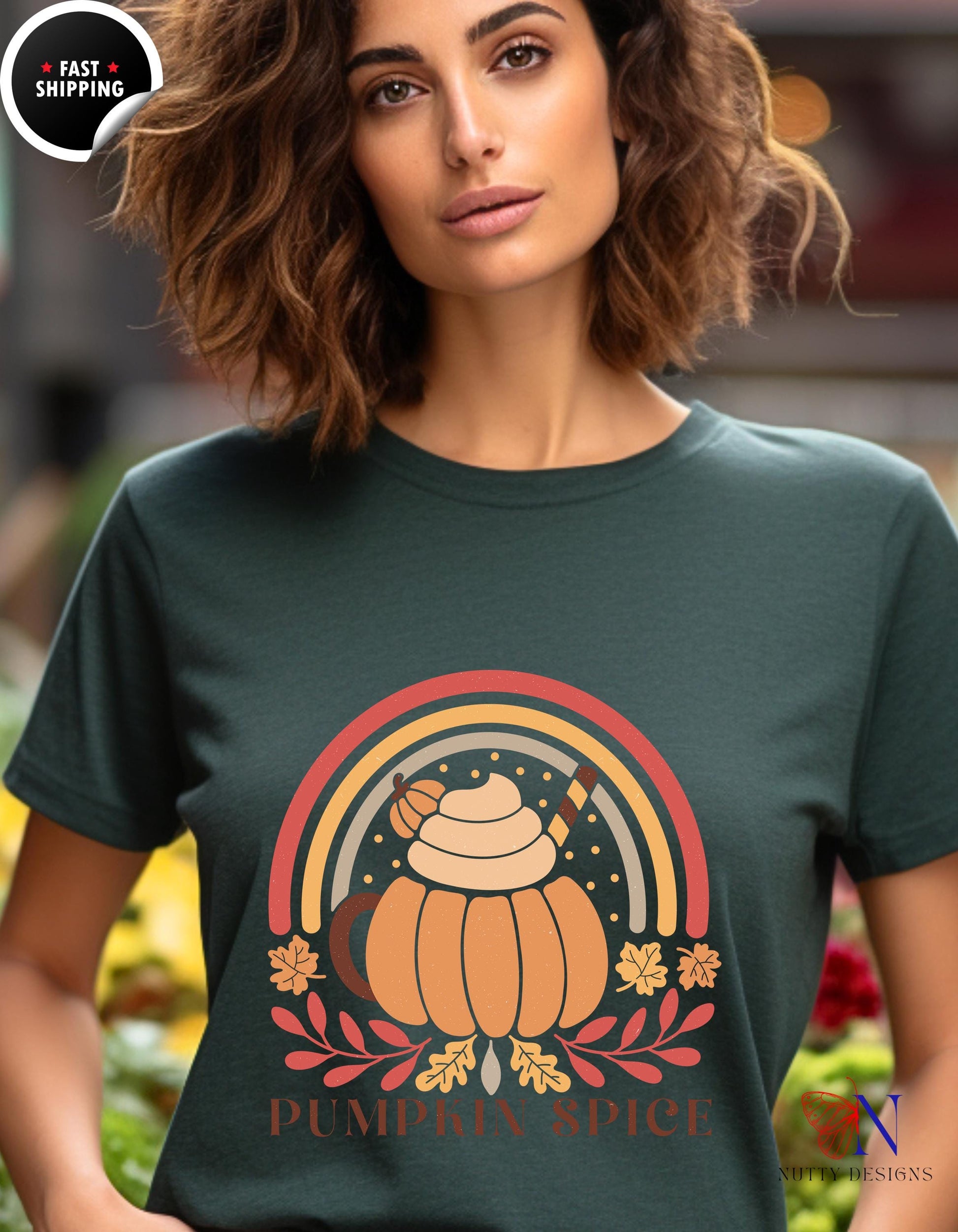 a woman wearing a green t - shirt with a pumpkin on it