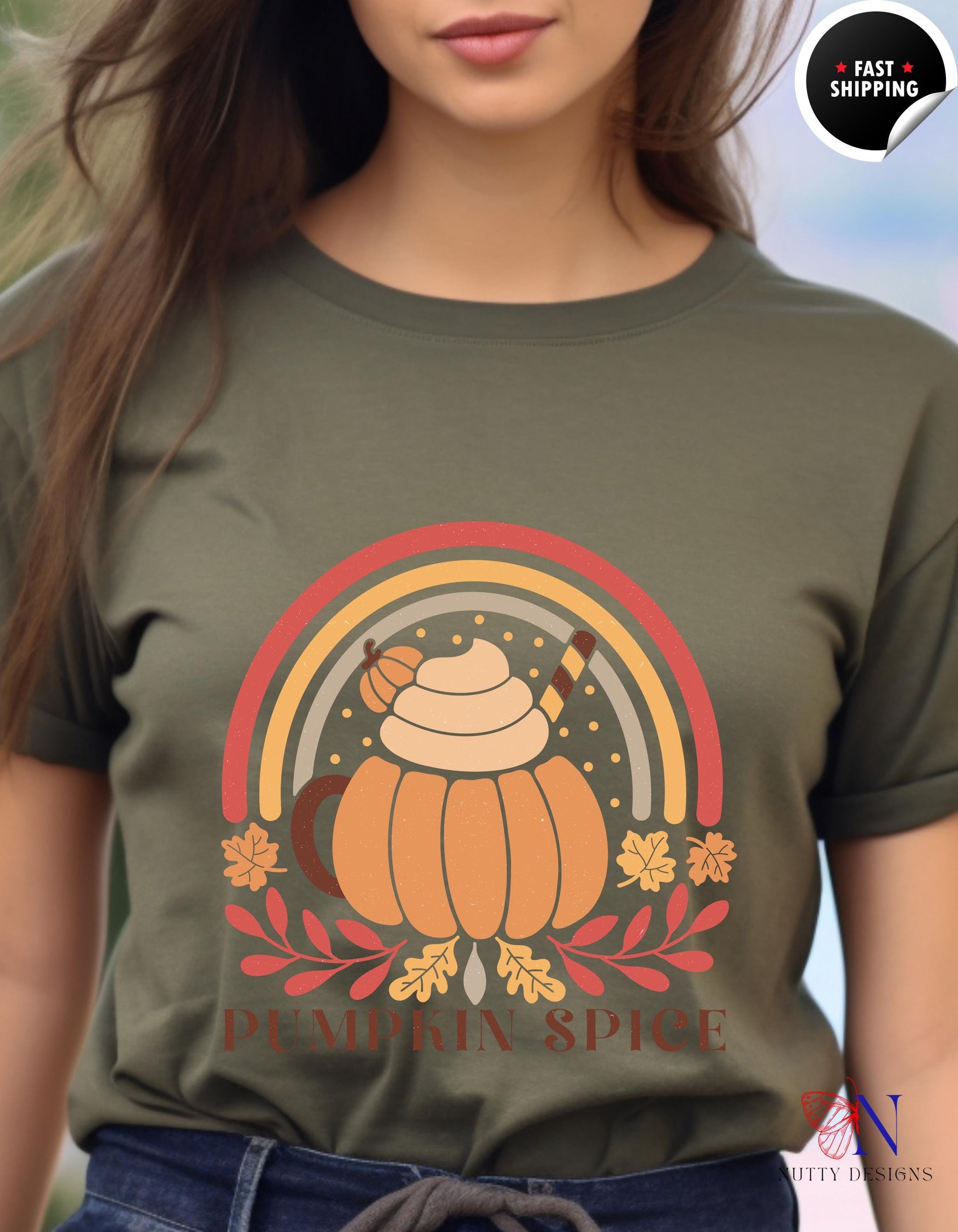 a woman wearing a green shirt with a pumpkin on it