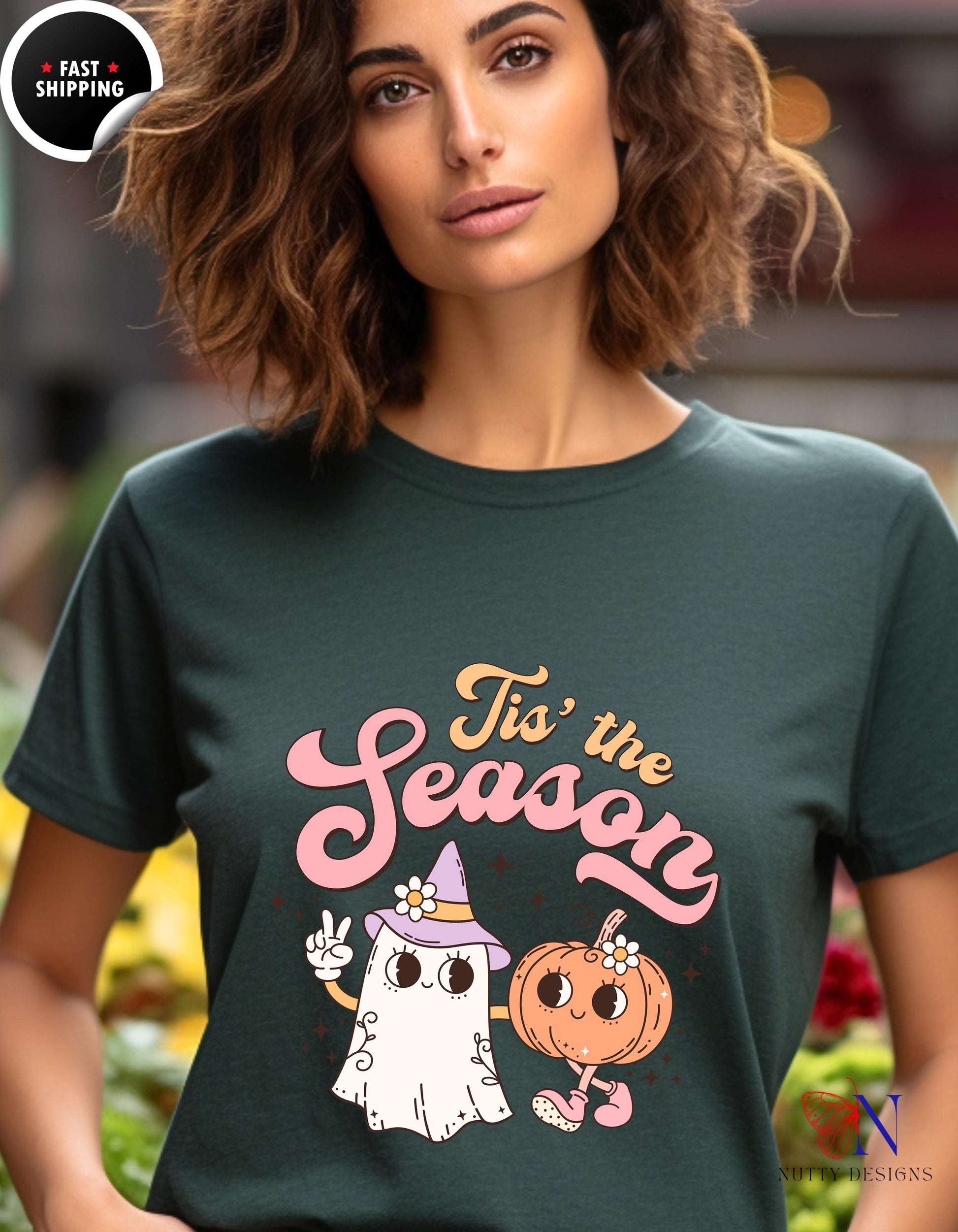 a woman wearing a t - shirt that says tis the season