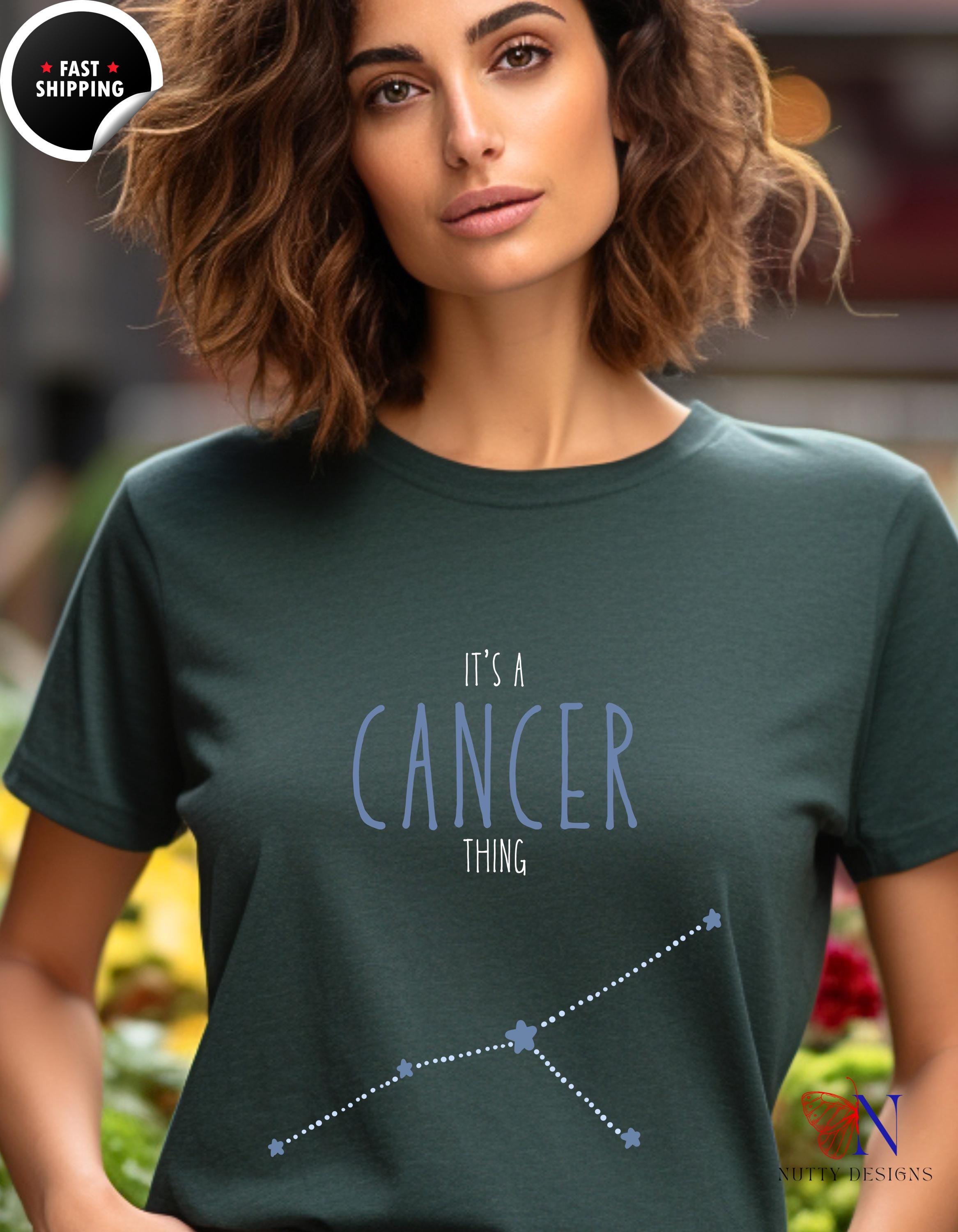 a woman wearing a t - shirt that says it&#39;s a cancer thing