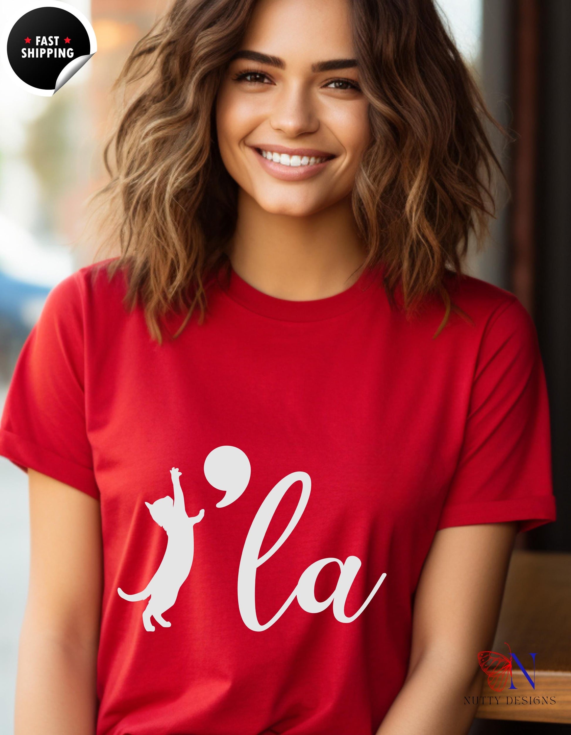 a woman wearing a red shirt with a white logo