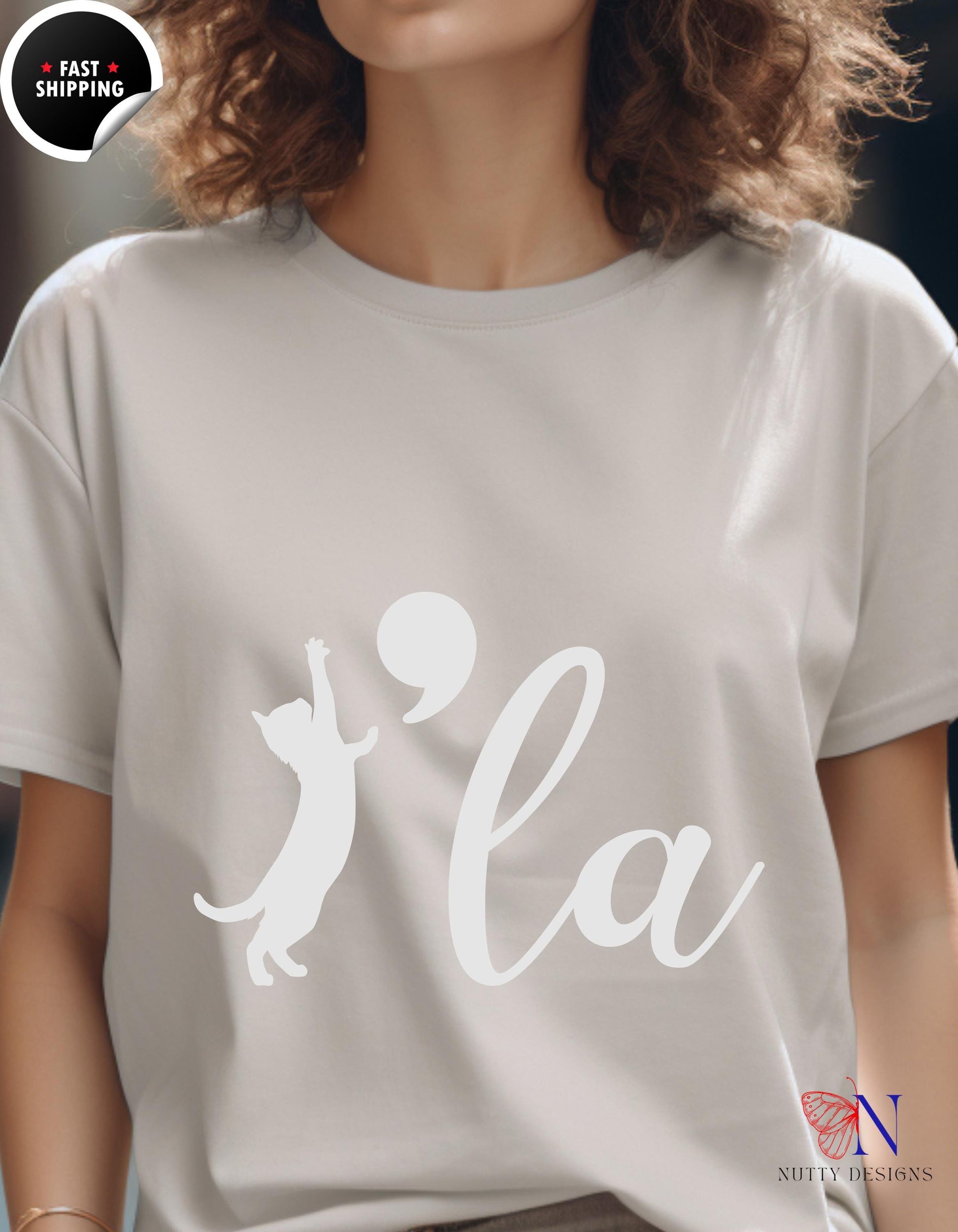 a woman wearing a t - shirt with the word la on it