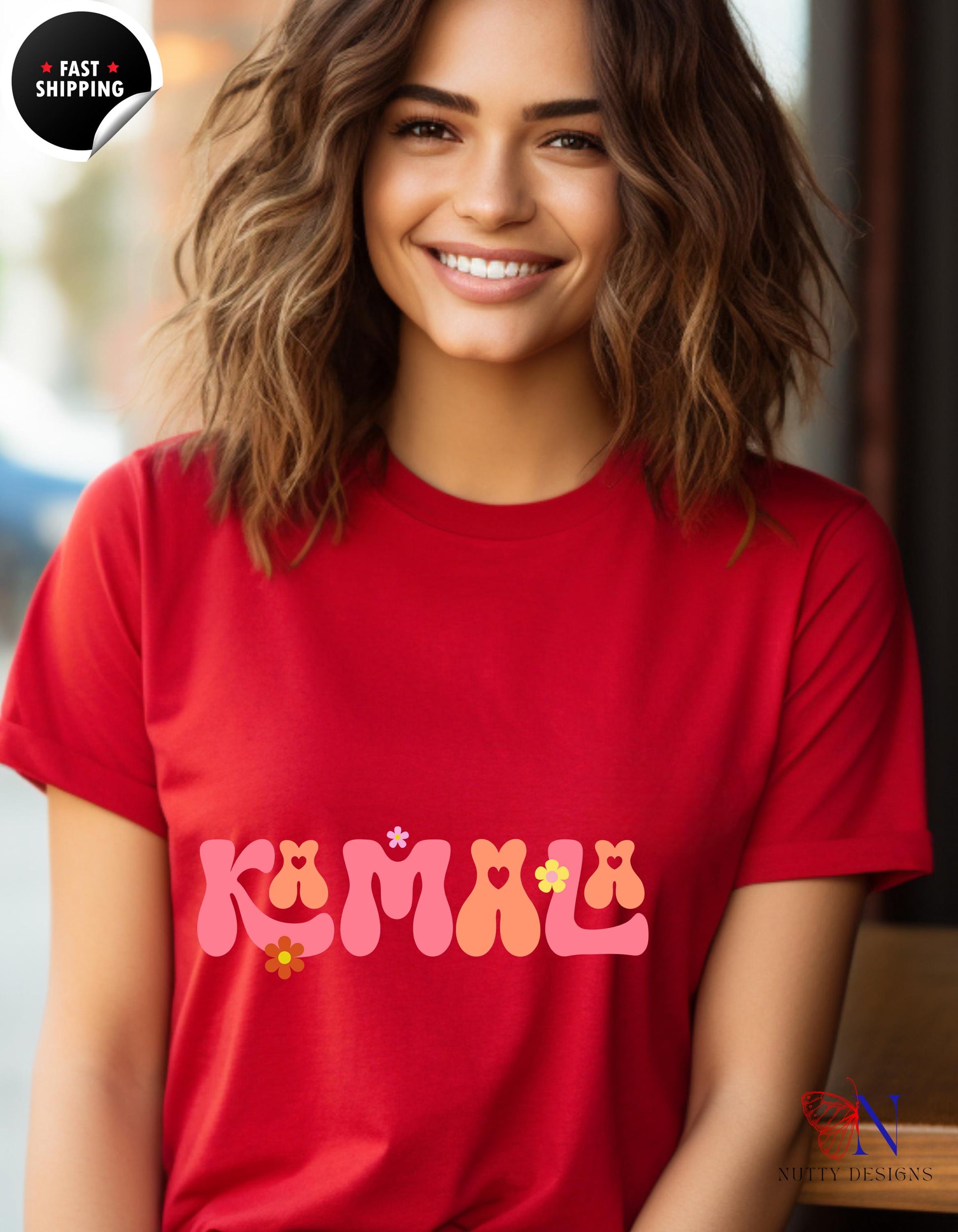 a smiling woman wearing a red shirt with a name on it