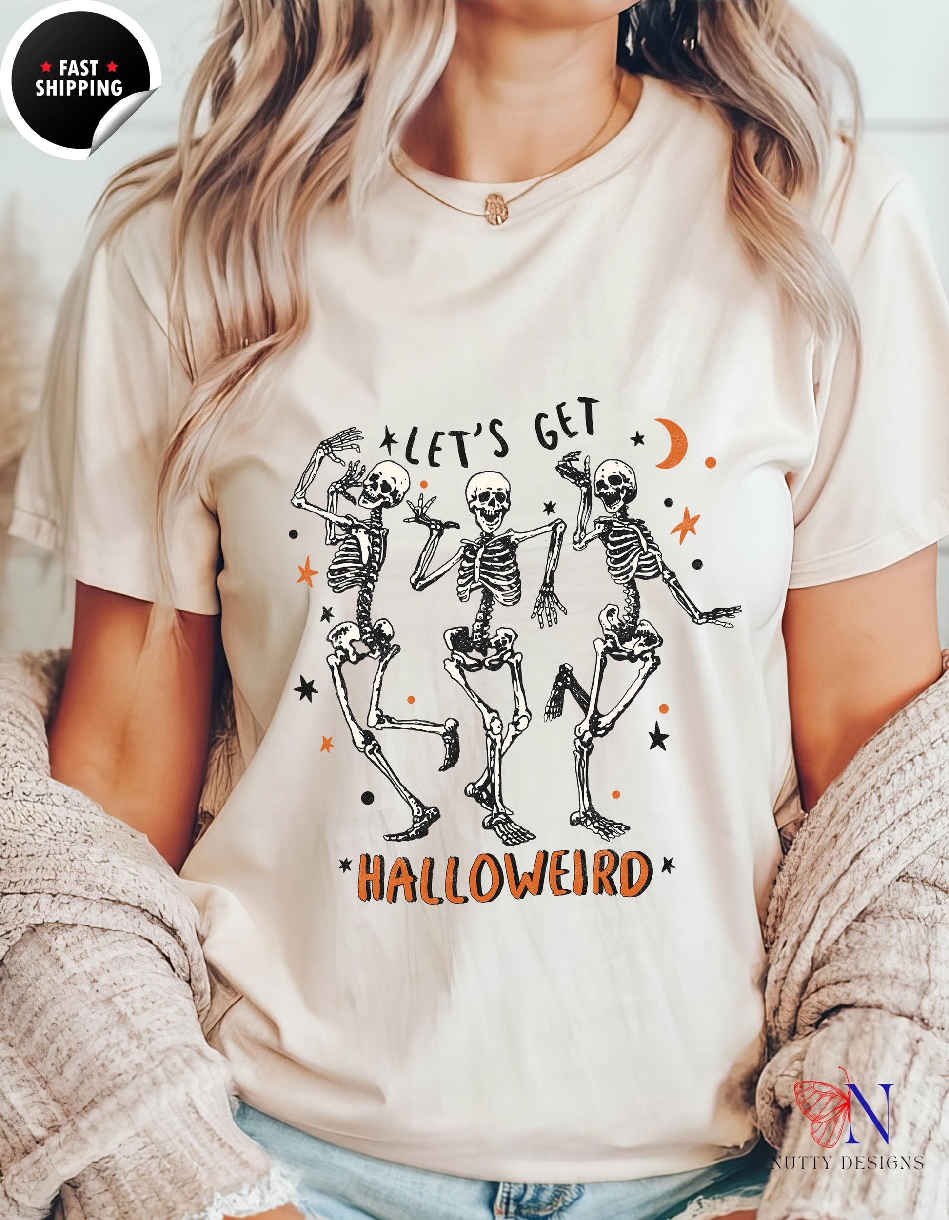 a woman wearing a t - shirt that says let&#39;s get halloween