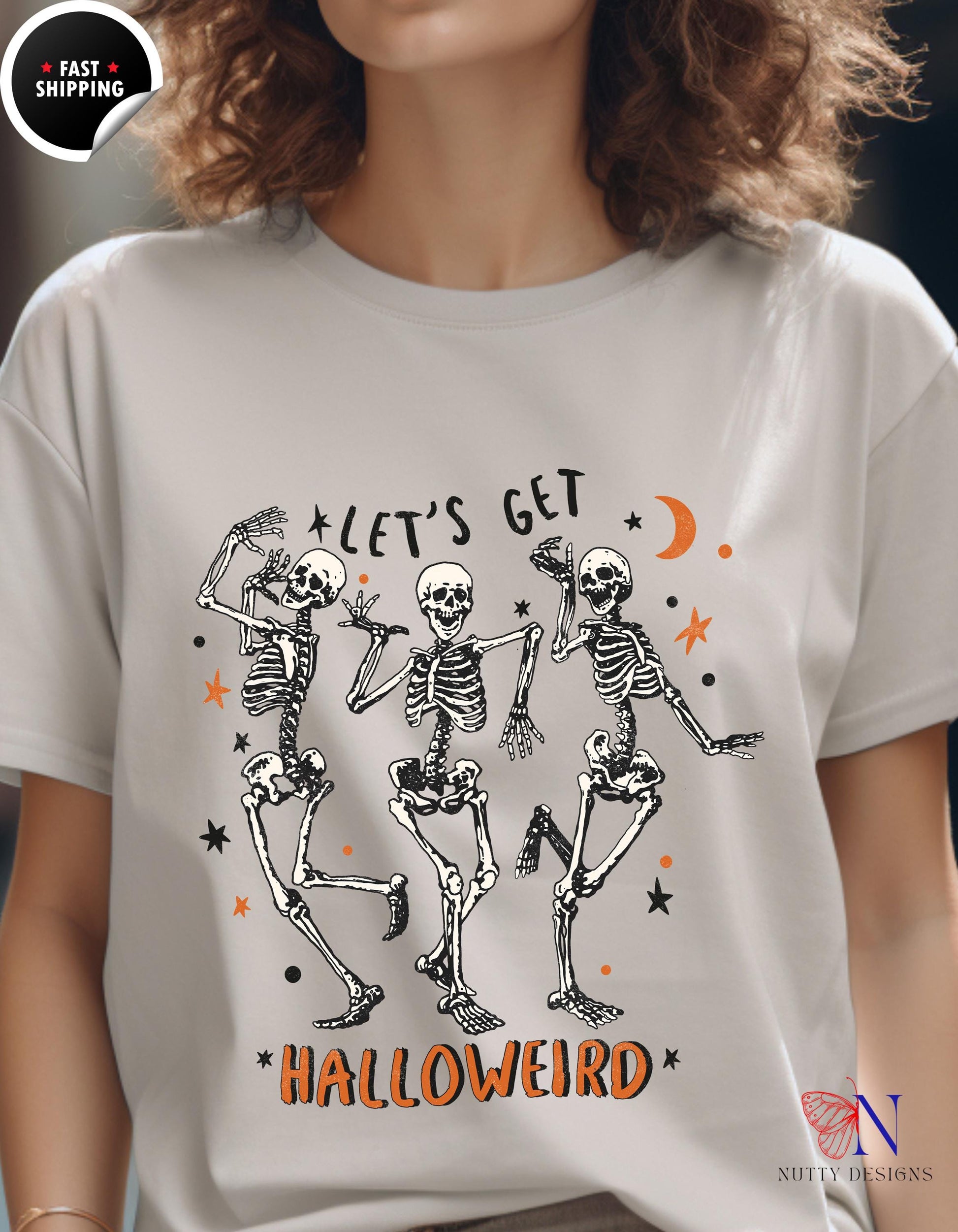 a woman wearing a t - shirt that says let&#39;s get halloween