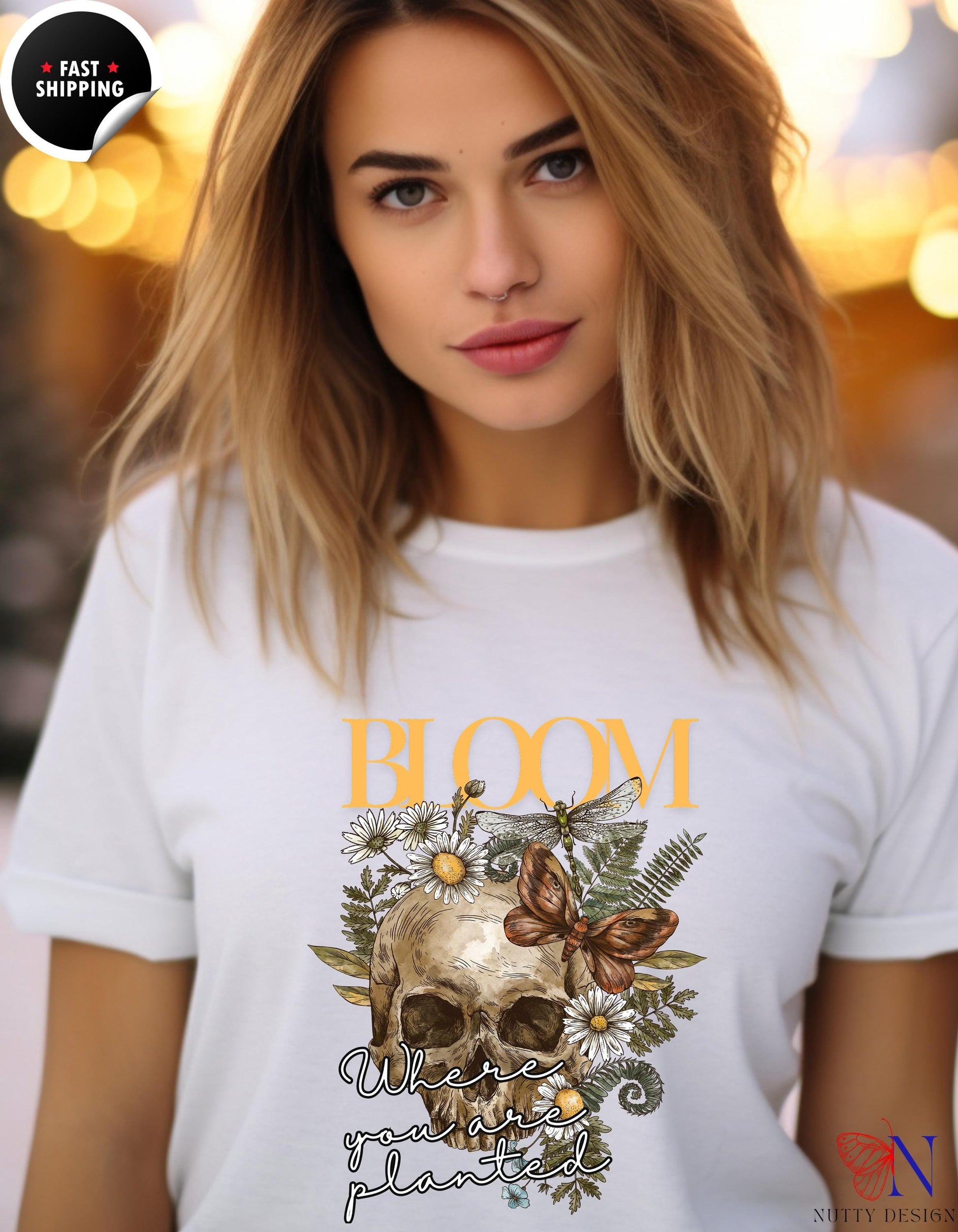 a woman wearing a t - shirt with a skull on it