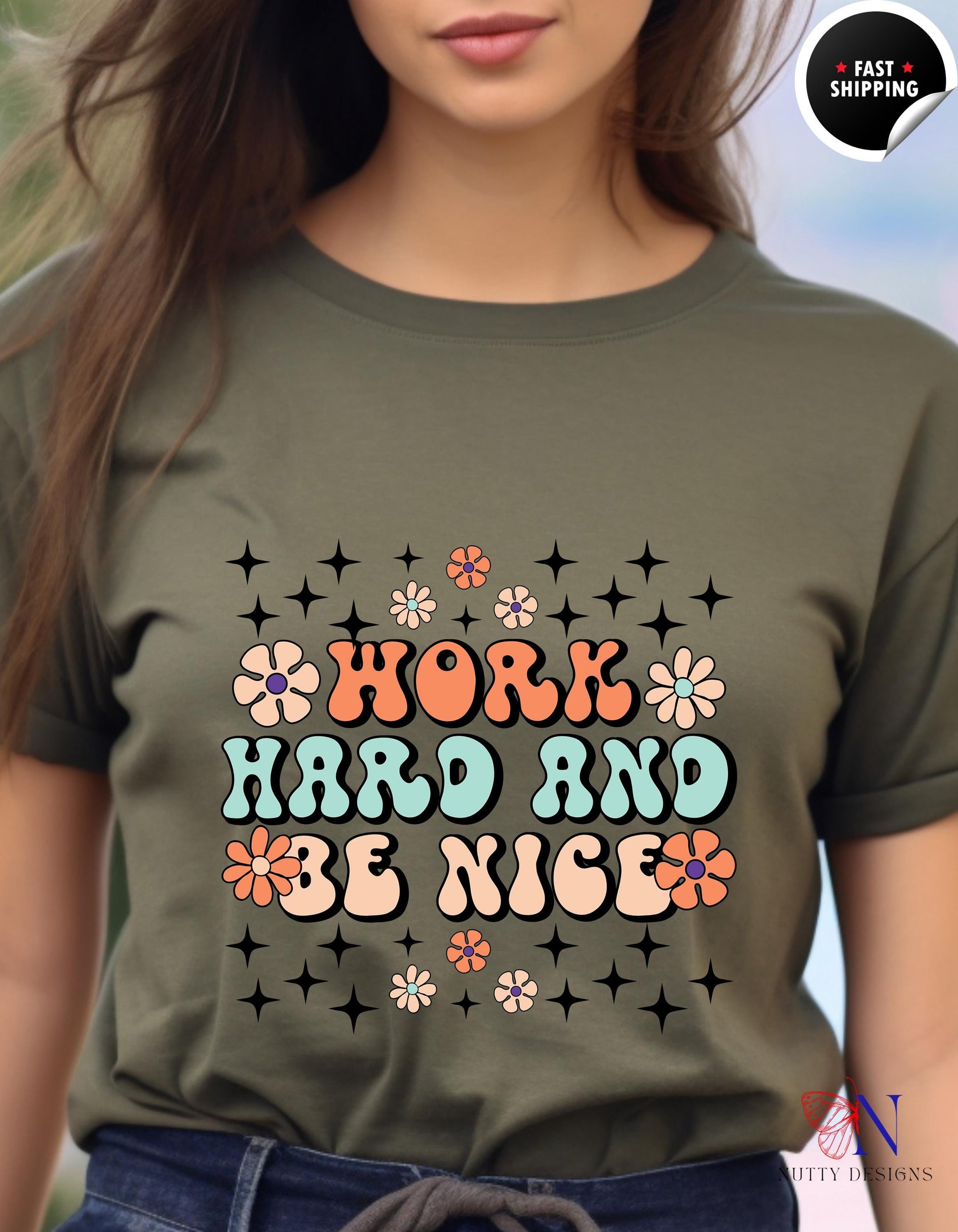 a woman wearing a t - shirt that says work hard and be nice