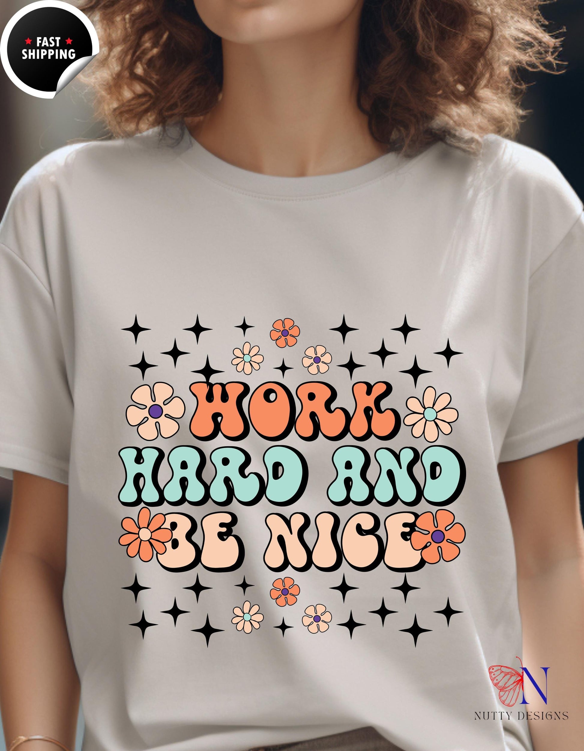 a woman wearing a t - shirt that says work hard and be nice