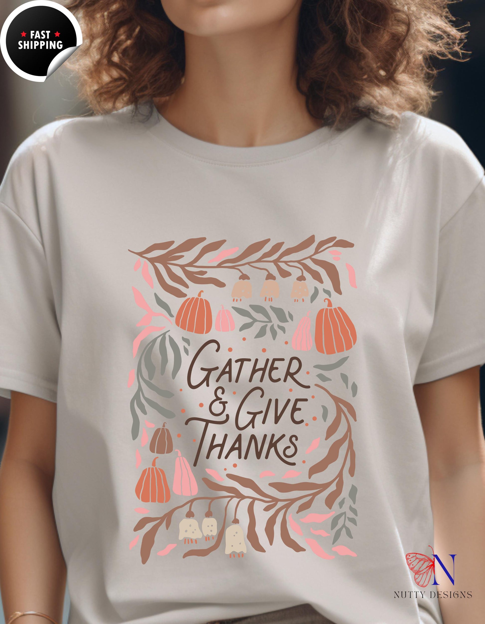 a woman wearing a t - shirt that says gather and give thanks