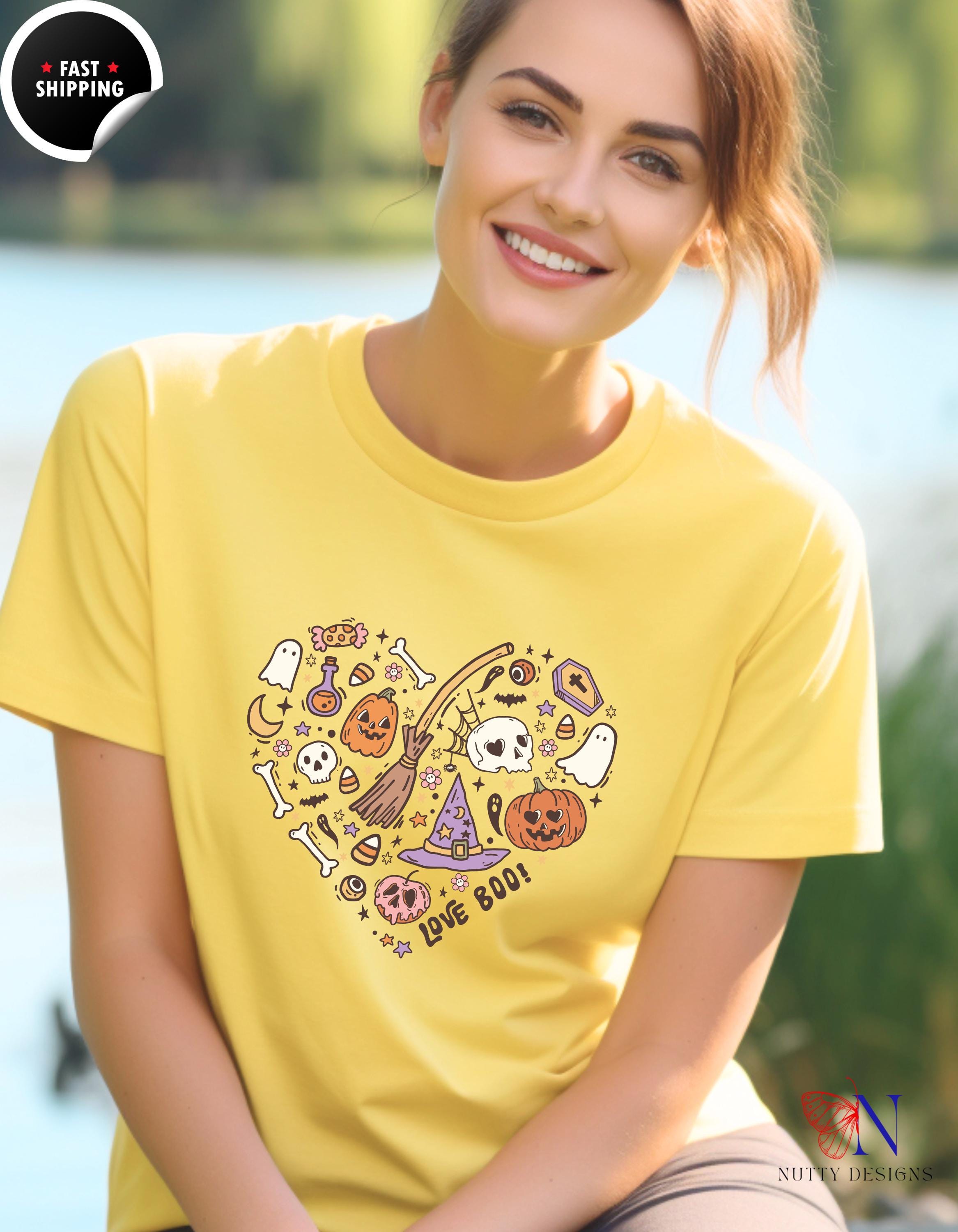 a woman wearing a yellow t - shirt is smiling