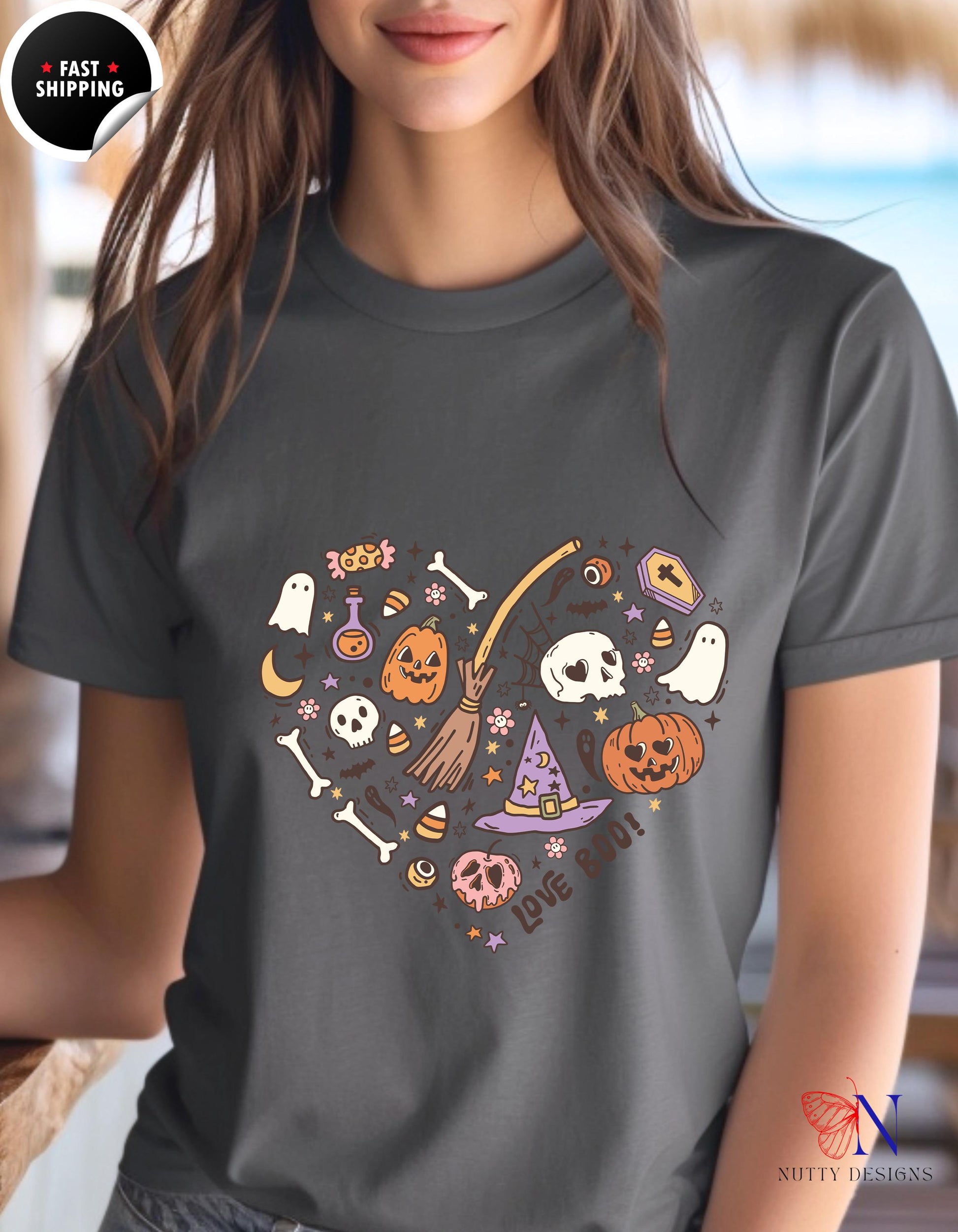 a woman wearing a t - shirt with a heart shaped halloween design