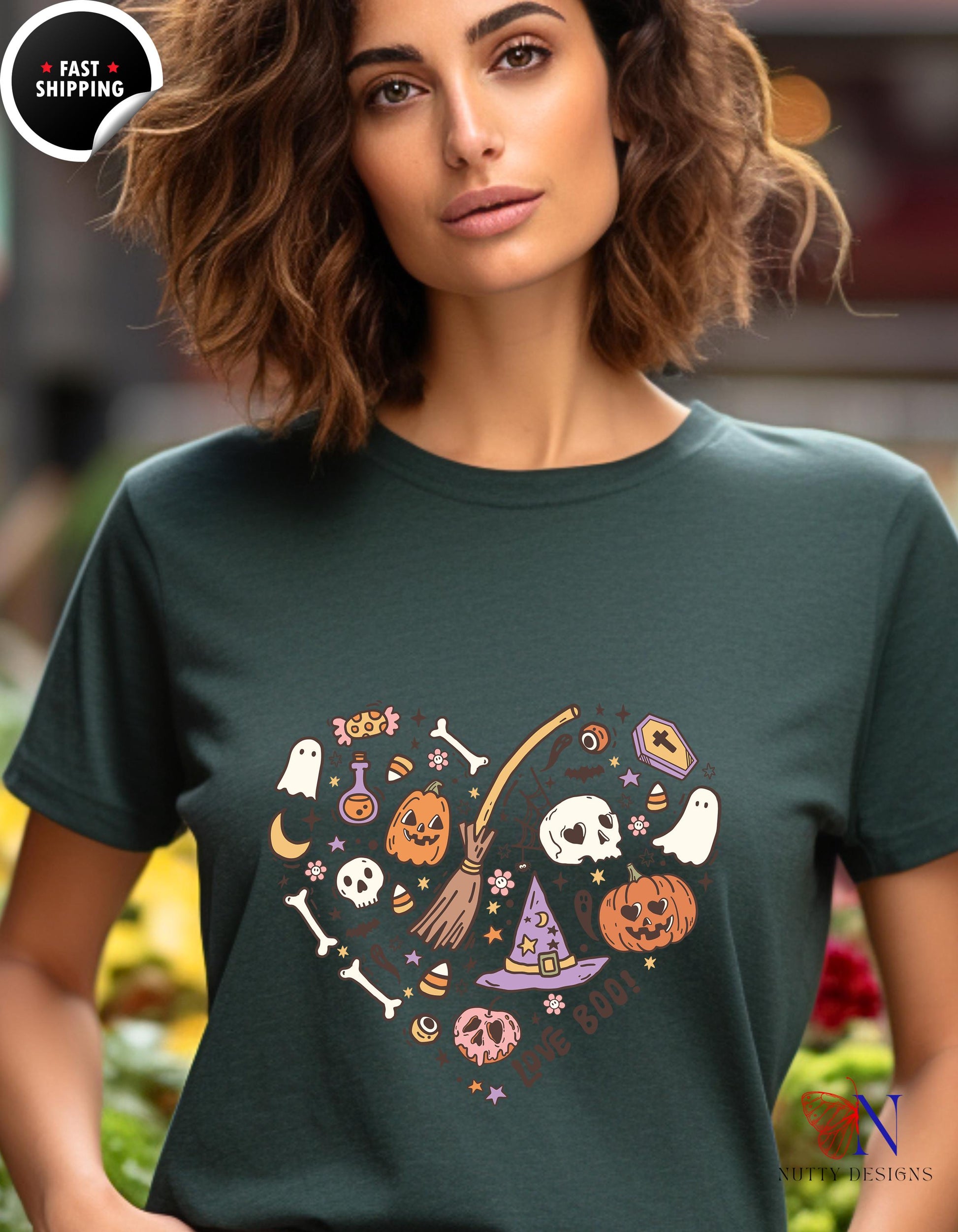 a woman wearing a t - shirt with a heart shaped halloween design