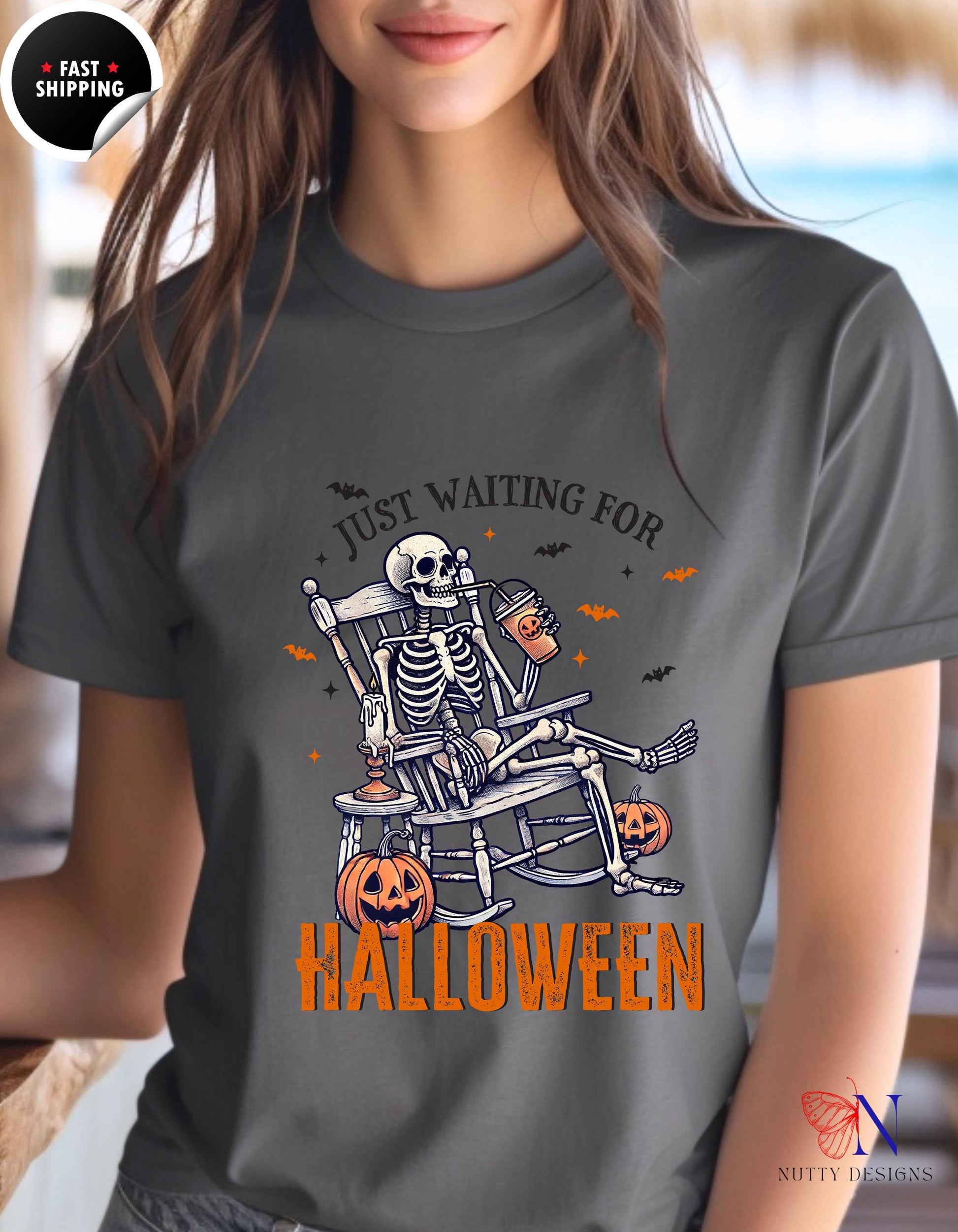 a woman wearing a t - shirt that says i&#39;m waiting for halloween