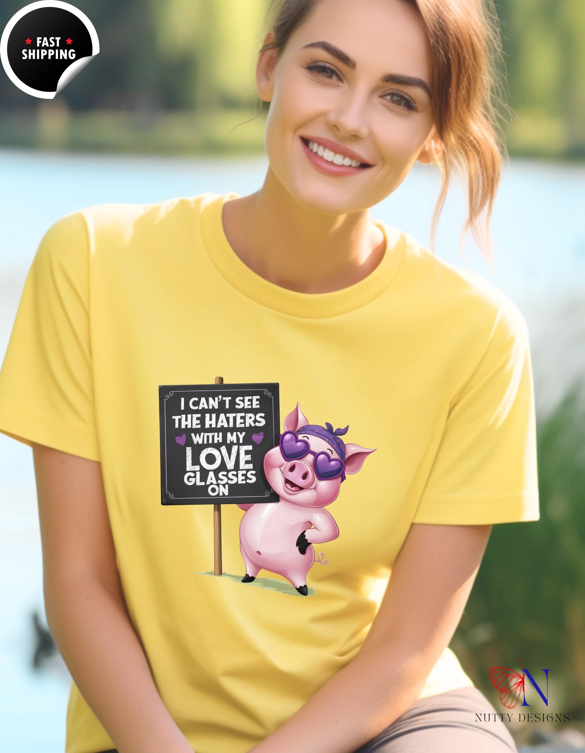 a woman wearing a yellow shirt with a pig on it