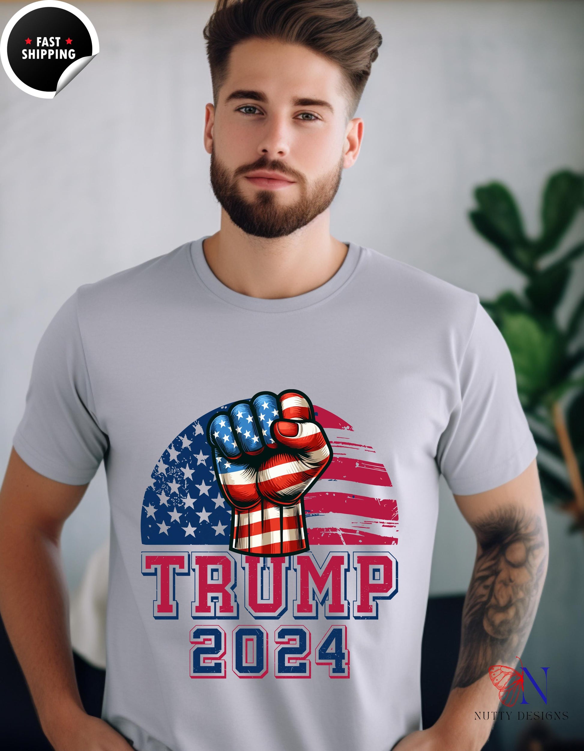 a man wearing a t - shirt that says trump