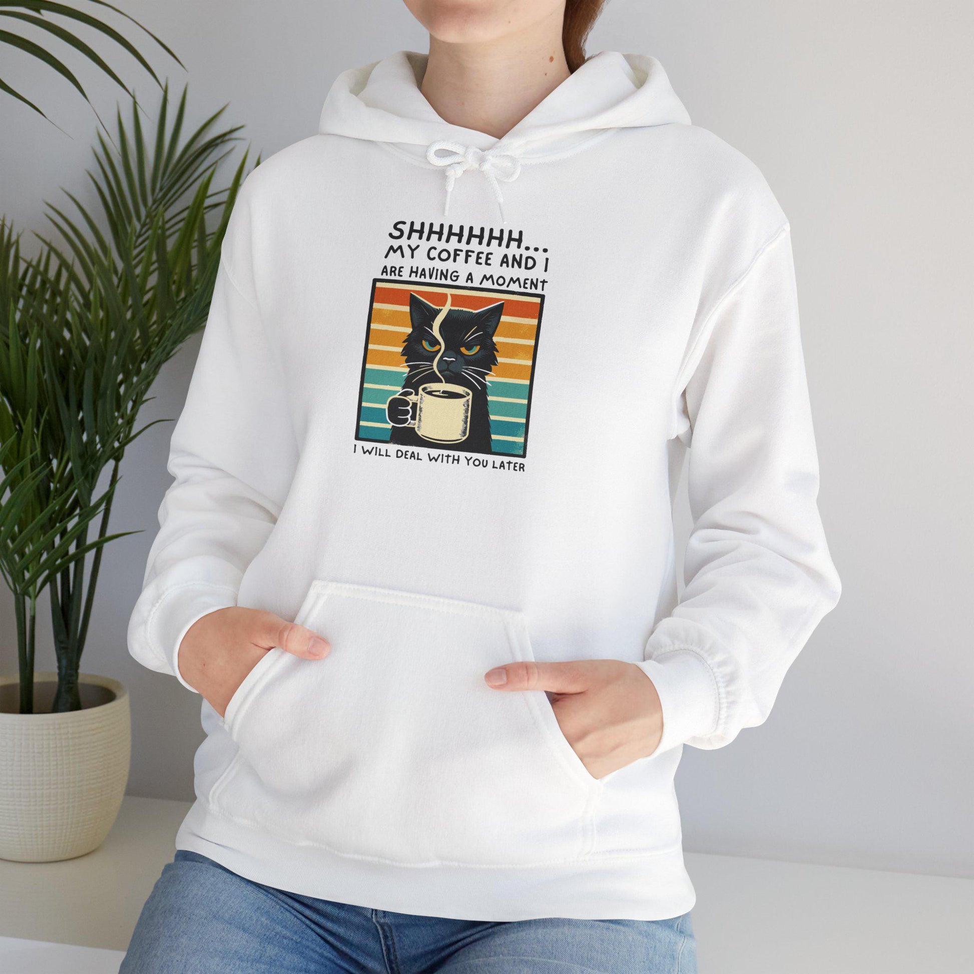 Unisex funny hoodie with cat graphic saying "Shhhhh, my coffee and I are having a moment" in stylish design.