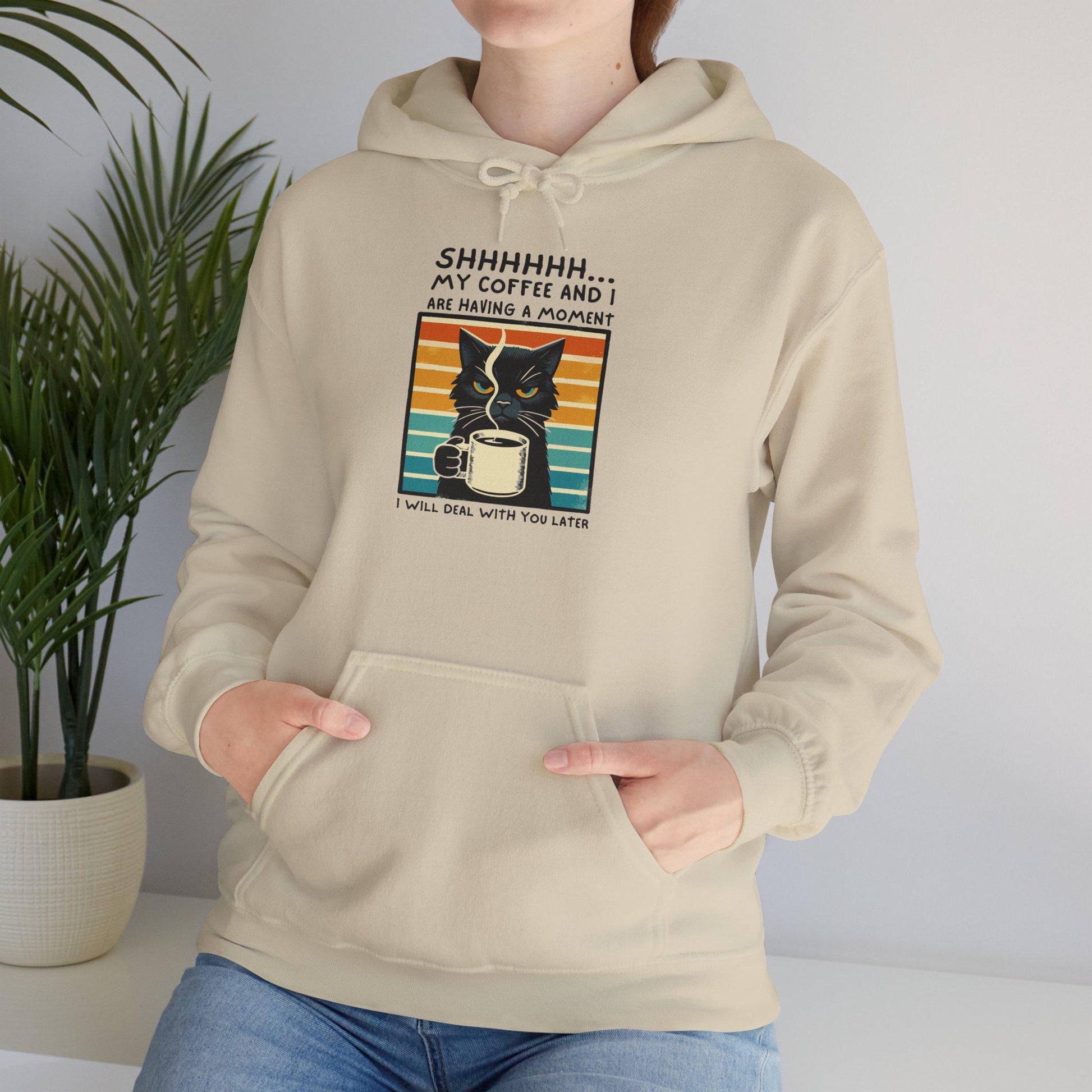 Unisex funny hoodie with cat design saying 'Shhhhhh, my coffee and I are having a moment', ideal for cozy warmth.