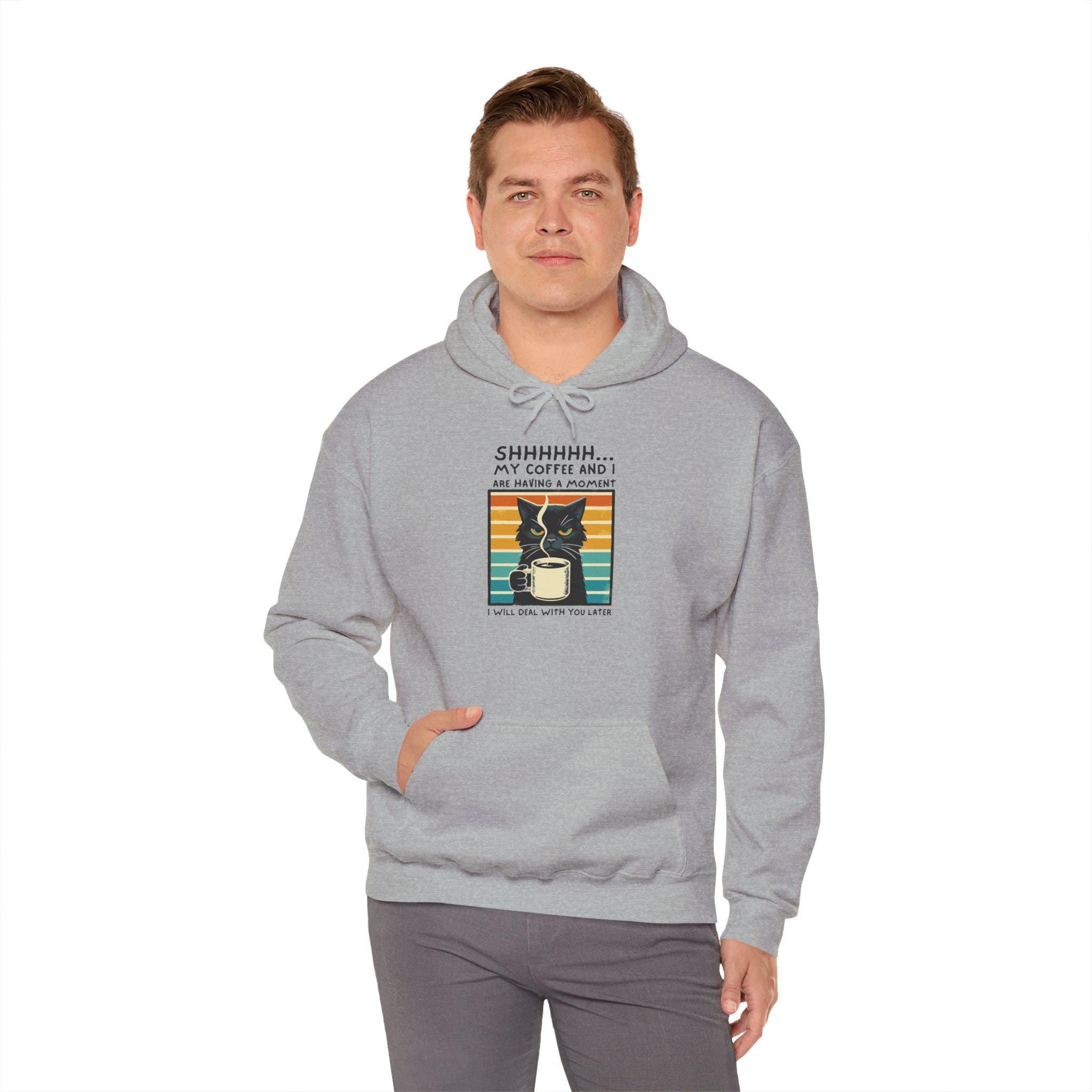 Unisex gray hoodie with "SHHHHHH My Coffee and I are having a moment" graphic design, featuring a kangaroo pocket.