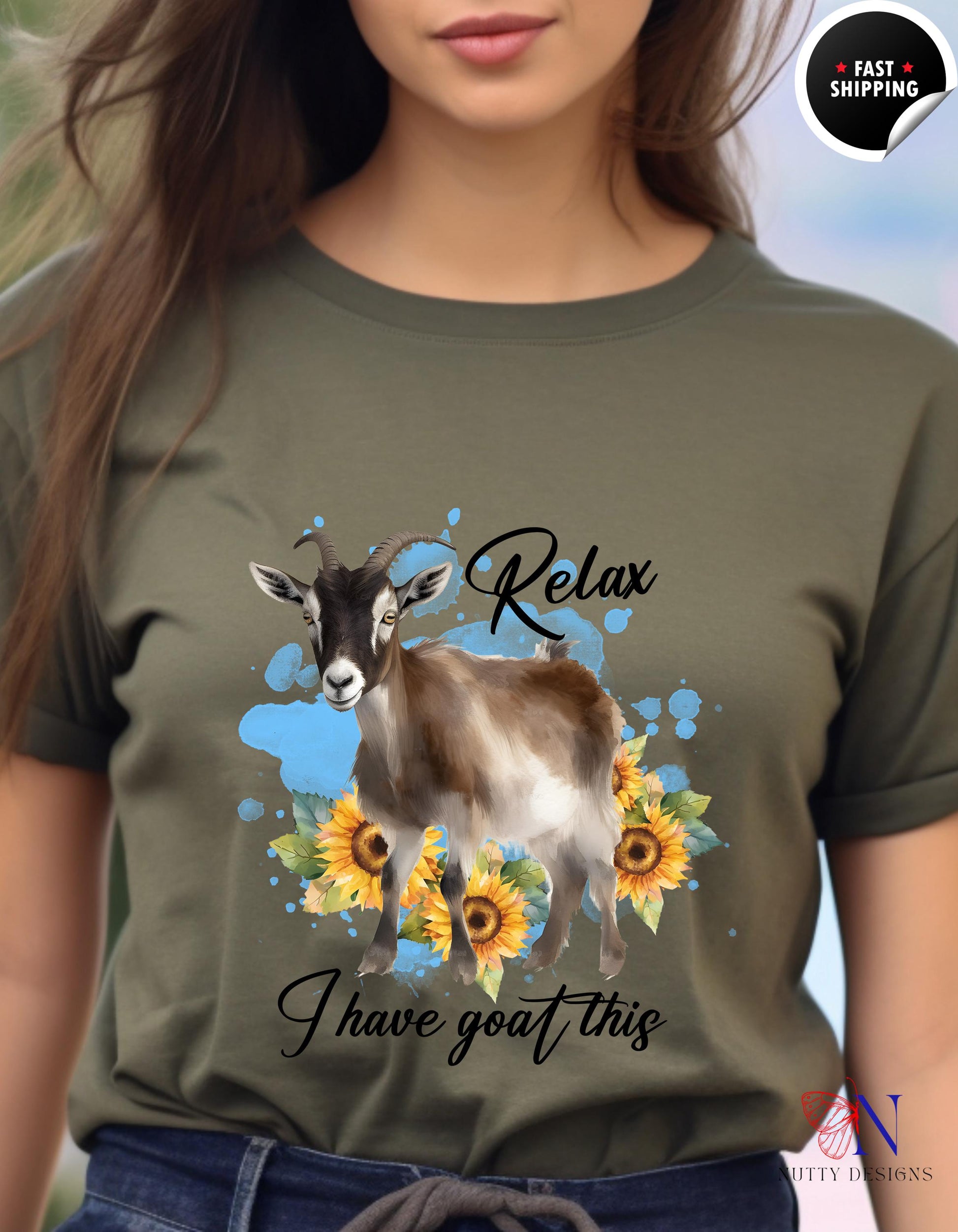 a woman wearing a t - shirt with a goat and sunflowers on it