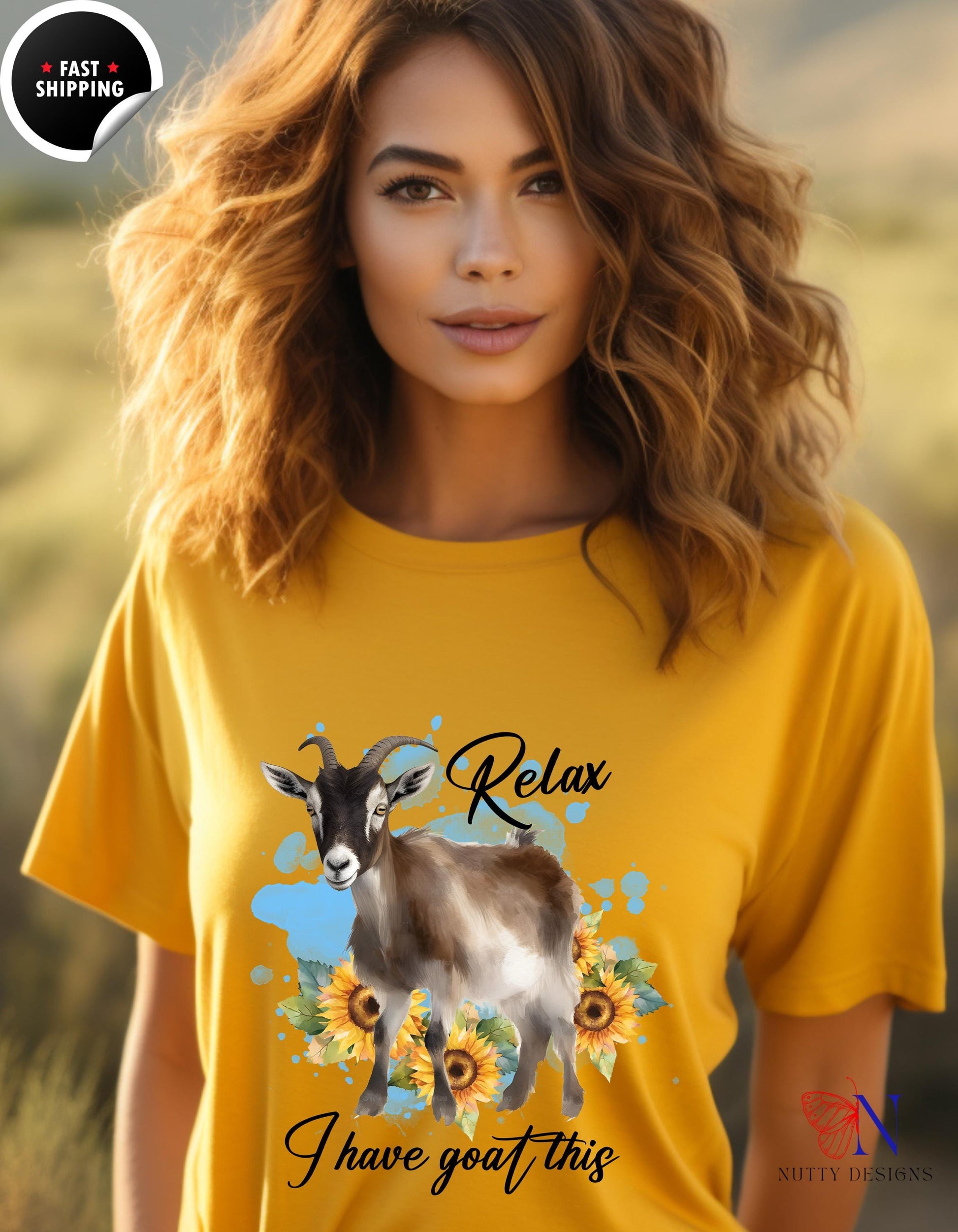 a woman wearing a yellow shirt with a goat on it