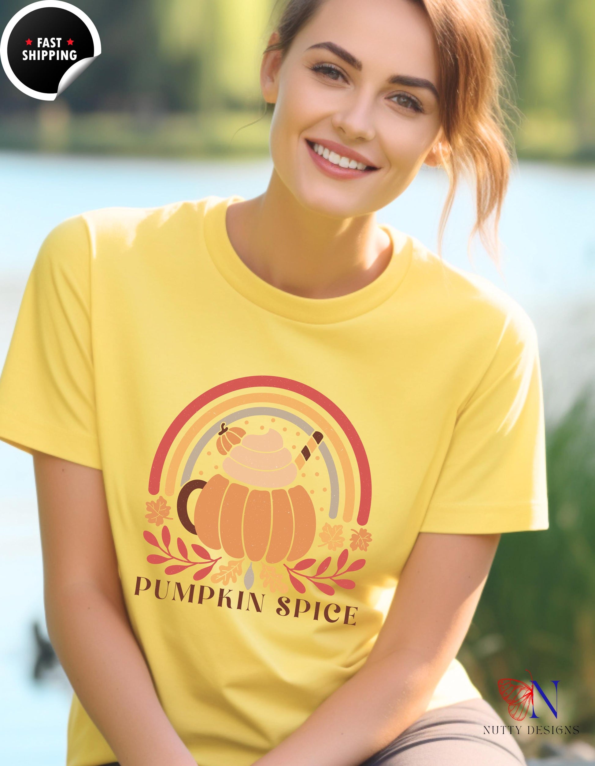 a woman wearing a yellow shirt with a pumpkin on it